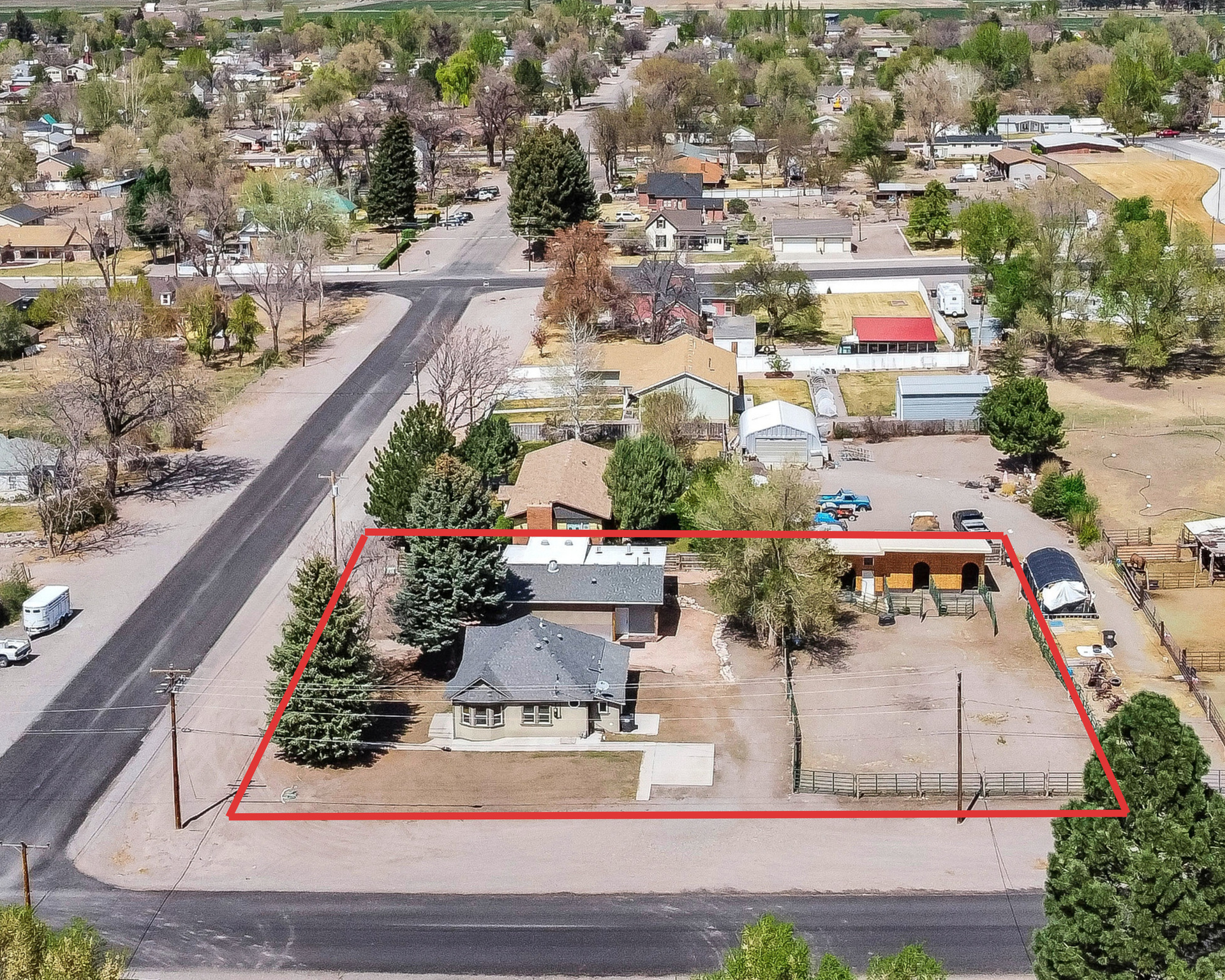 This Monroe property has a little bit of everything. Sitting on a half-acre corner lot, there's room to spread out, room for animals, room for hobbies, and plenty of flexibility depending on what you need.  The home itself is comfortable and easy to maintain with 2 bedrooms, 1 bathroom, and just under 1,200 square feet. It has a warm, lived-in feel and also includes whole house fans to help keep things comfortable year-round.  The real standout here is the detached building. At nearly 1,500 square feet, it has been set up as a professional sound and recording studio with 10 skylights bringing in incredible natural light throughout the space. Whether you're a musician, podcaster, photographer, artist, content creator, or just need an amazing workspace, it's a setup that's hard to find. And if studio space isn't your thing, the building could easily work as a large garage, shop, or workshop.  Outside, the property is already set up for horses and animals with stalls and panels in place, making the space functional from day one.  Properties like this don't come around often because they offer so many possibilities. If you've been looking for a place with usable land, extra shop space, and something beyond the typical residential setup, this one is worth a look.  Square footage figures are provided as a courtesy estimate only and were obtained from county records. Buyer is advised to obtain an independent measurement.