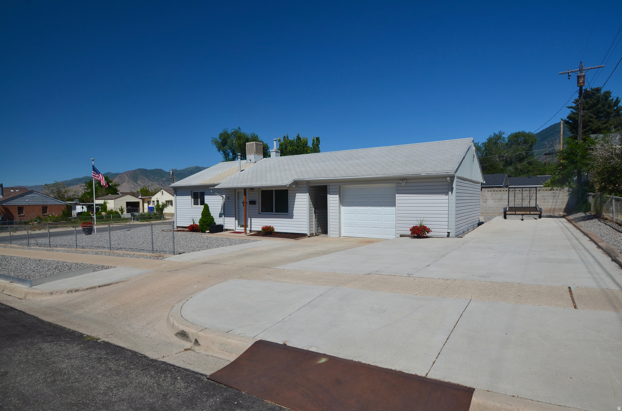 Comfortable & Convenient! This compact upgraded home is big on updates!  New kitchen was installed just prior to my seller purchasing, and windows, siding, furnace (completed as to accommodate a a/c unit when installed), water heater & doors in '17 or '18 and solar was added in '21.  Tiled focal wall in living room and tiled backsplash and bathroom areas.  Majority of the lawn (including the sprinkler system) was removed within the past year and area covered in gravel - the lot is mostly fenced and has concreted parking strip for the RV, utility trailer or extra vehicles.  The back patio area had been covered with an awning, a windstorm had pulled it down, it is disassembled and kept in the garage.  The oversized one car garage has storage shelving along southern wall.  Managable spaces without loss of functionality!