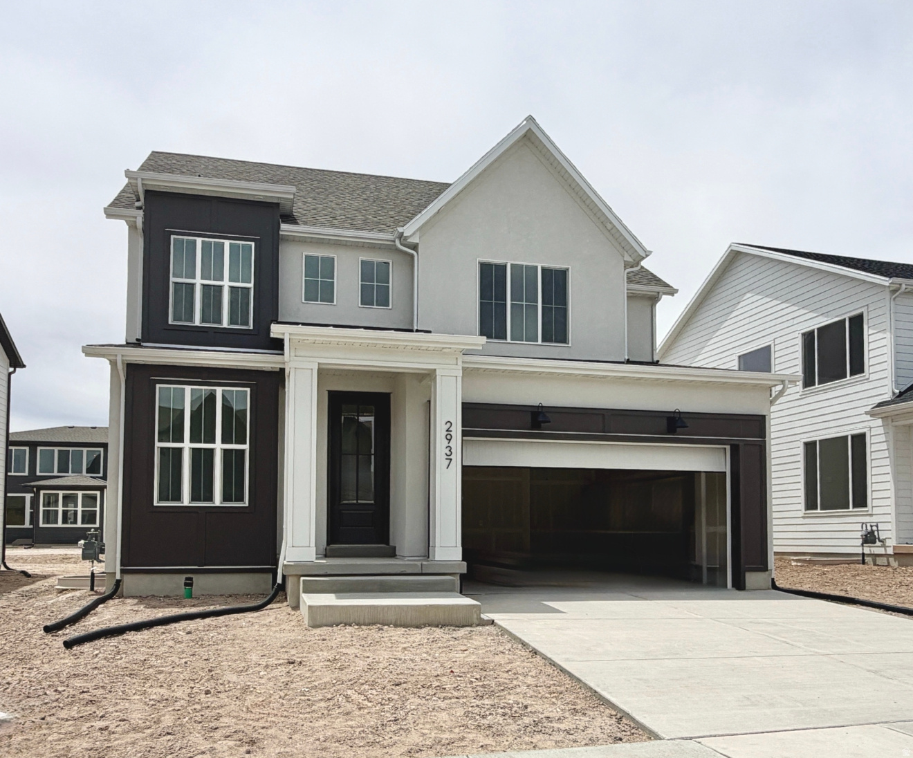 *To be completed by Summer-2026* The Interlaken is a sophisticated two-story home offering over 3,000 sq ft of modern elegance and practical living. The main floor features an airy open-concept layout, seamlessly connecting the kitchen, dining area, and living room, perfect for daily living and entertaining. A mudroom off the garage keeps clutter at bay. Upstairs, three spacious bedrooms, including a luxurious primary suite with an expansive walk-in closet, provide peaceful retreats. Two additional bedrooms with walk-in closets share a full bathroom, and a centrally located laundry room adds convenience. Thoughtful design and meticulous details make the Interlaken a perfect blend of charm and functionality.