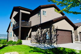 Nestled on the mountainside with panoramic views overlooking Midway City and the entire Heber Valley is a perfect home - especially for recreation enthusiasts!  Located minutes from Deer Valley, Park City, and Sundance ski resorts as well as Wasatch Mountain State Park, Deer Creek State Park, the Soldier Hollow Olympic venue, Zermatt Resort, the Homestead Crater, hiking and mountain bike trails, world class trout fishing on the Provo River, and of course three nearby golf courses.  The two main levels have walkouts leading to a quiet and peacefl rustic deck and patio with 180 degree views of the entire valley. Main floor living includes: bedroom, bathroom, den, laundry, mud room, kitchen, dining room, and a great room with 19 foot vaulted ceiling and double facing stone fireplace. Lower level living includes bedroom, bathroom, TV room, large recreation area with surround sound, a separate den and lots of cold storage space. Top floor has a sitting area overlooking the great room, a guest bedroom, a master bedroom and ensuite that are oversized and include 10' ceilings, separate shower and jetted tub, and double entry closet, plus sliding glass doors opening onto a private second story deck.  One of the largest twin homes in the area (4,225 completely finished square feet). Landscaping maintenance and snow removal are provided by the HOA. Major furnishings and appliances are included - start enjoying right away! (Square footage from county records and previous MLS listings - buyer responsible to verify all square footage)