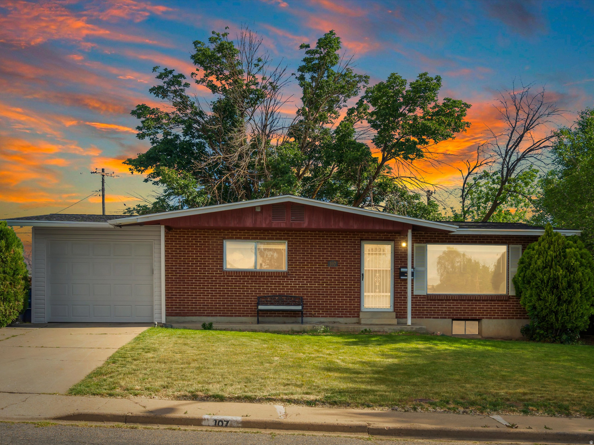 Welcome home to this charming, well-cared-for brick rambler in Sunset offering 1,850 sq ft of comfortable living space with room to grow! Upstairs features an updated kitchen with granite countertops, laminate flooring, 2 bedrooms, and a full bath. The unfinished basement offers a great, flexible space to use now, and potential to easily add 2 additional bedrooms and another bathroom - creating an excellent opportunity for future growth and added value. Outside, you'll love the convenience of the attached 1-car garage, fully fenced and landscaped yard, no backyard neighbors, and the beautiful new Trex patio that's perfect for backyard BBQs and entertaining. Additional updates, including a new roof and water heater, make this home truly move-in ready. Conveniently located near shopping, Hill Air Force Base, and easy freeway access, this is one you won't want to miss!