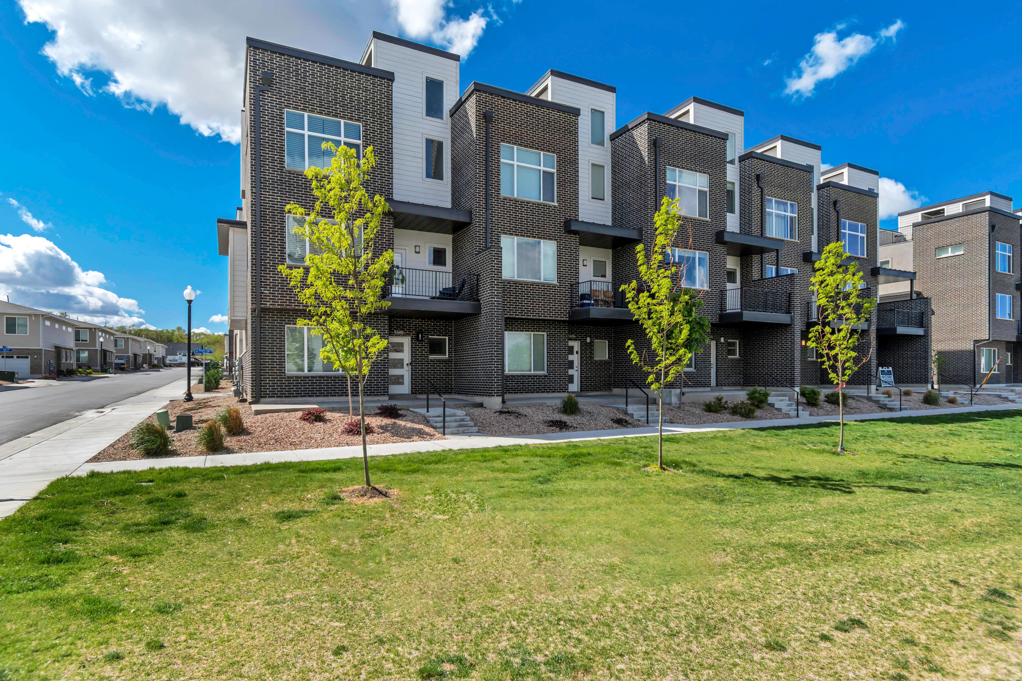 Modern design, unbeatable views, and rare investment flexibility make this exceptional end-unit townhome in the highly sought-after Erin Hills Townhomes a standout opportunity in the heart of the Salt Lake Valley! Conveniently located near schools, shopping, restaurants, and the new University of Utah Hospital site, this home offers both lifestyle and location! This contemporary multi-level floor plan features 4 bedrooms and 4 bathrooms, including two spacious primary suites-perfect for guests, roommates, multi-generational living, or added rental appeal. As a highly desirable end unit, large windows on three sides fill the home with natural light and create a bright, airy feel throughout! The beautifully appointed kitchen features quartz countertops, stainless steel appliances, and a functional layout designed for everyday living and entertaining. A second-level deck just off the main living space provides the perfect spot for morning coffee, outdoor dining, or weekend BBQs! The crown jewel of the home is the private fourth-level rooftop deck, where you'll enjoy stunning mountain views, sparkling valley lights, and unforgettable sunsets! Adding even more value, this rare community allows short-term rentals, making it an ideal primary residence, second home, or investment property! Residents also enjoy access to community amenities including a playground, pickleball courts, and a picnic area with a gazebo for gatherings and celebrations! Opportunities like this don't come along often! Stylish, versatile, and perfectly located, this home truly has it all! Buyer to verify square footage and all listing details.