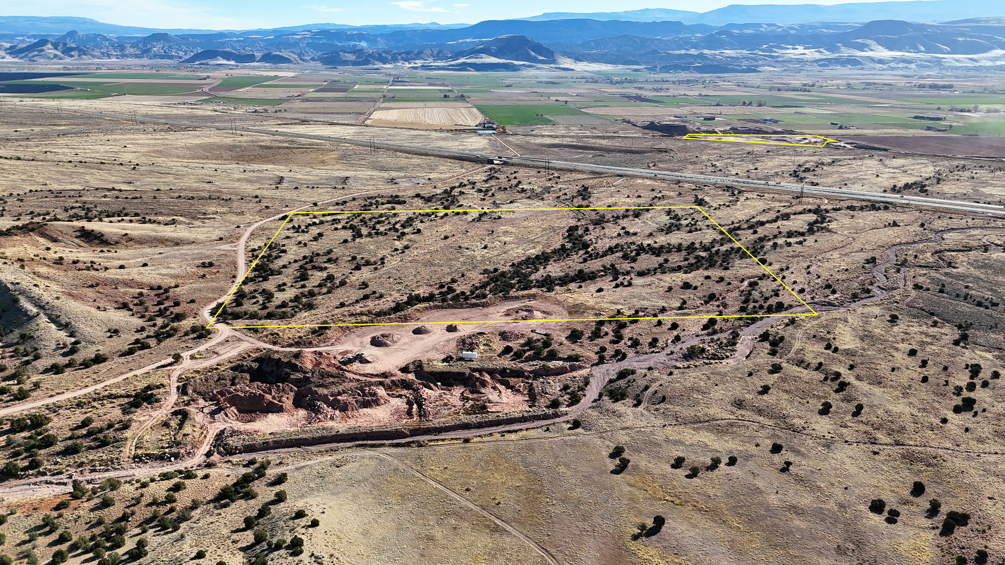 Located just outside Richfield, Utah, this 40-acre gravel-rich property offers a combination of natural gravel and stone resources, access, and operational flexibility. Positioned near potential I-70 frontage with a lease to a recharging alluvial deposit, the land provides an opportunity for ongoing or expanded gravel and stone extraction. The topography is primarily flat to gently rolling, reducing the amount of clearing required before beginning or continuing operations.  In addition to the 40-acre gravel parcel, the offering includes a 14-acre yard area. This space supports operational use with nearby power, a semi loading ramp, on-hand inventory, and the offering has lease access to two rock distribution sites along the Wasatch Front. These locations serve major population centers, allowing materials to be transported efficiently to high-demand regions.  The material profile on the property is diverse. The active extraction area contains products ranging from pea gravel to boulders weighing more than one ton. The rock is marketed as Strawberry Cream and has been used for a variety of landscape and construction applications, including decorative rock, road and driveway base, flower beds, drainage material, pipe bedding, and erosion management. The stone shows a wide range of natural colors, including white, red, pink, purple, yellow, brown, black, and green, providing versatility for landscaping suppliers and end users. Currently available product sizes include one-half inch minus, one and a half inch minus, and two inch plus.  Beyond the stone materials, the property also contains iron-rich native soil known as Ferrozite. This soil has characteristics that support plant micronutrient availability through slow release. Laboratory testing performed by Stukenholtz Laboratories indicates that the soil is high in iron and also contains elevated levels of nitrogen, phosphorus, potassium, sulfur, zinc, and manganese. These attributes make it suitable for agricultural or horticultural blends where micronutrient availability is valued.  The combination of gravel, boulders, soils, equipment access, and distribution infrastructure positions the property as an option for expanding an existing materials business or establishing a new site with minimal initial groundwork. The relatively open terrain supports efficient equipment movement and operational planning.  Richfield is the closest city, located only minutes away, offering access to fuel, groceries, hardware, lodging, and service businesses. Larger communities along the Wasatch Front-such as Provo, Orem, and Salt Lake County-can be reached through existing distribution channels associated with the current operation.  Additional acreage and water rights or shares may be negotiable as part of the purchase, allowing flexibility for expansion depending on a buyer's goals. With its combination of location, material diversity, operational infrastructure, and potential for long-term extraction, this property provides an opportunity to own a functional and versatile materials site in central Utah.