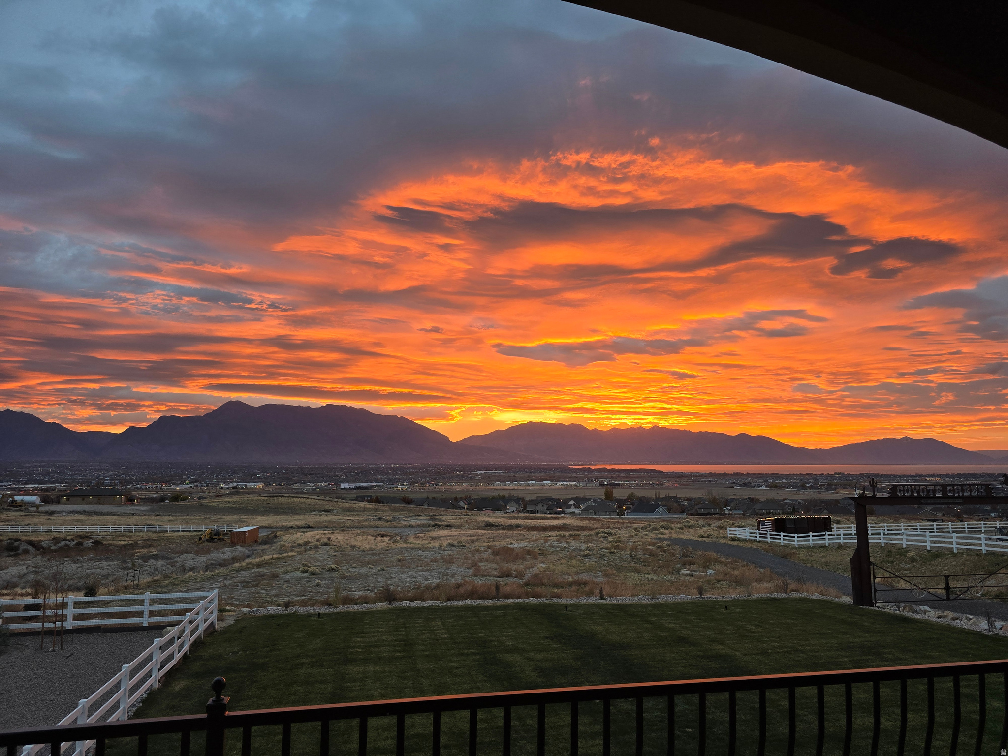 MAJOR PRICE CORRECTION. Imagine waking up to beautiful sunrises looking over Utah Lake and Mount Timp every day, knowing your view will never be blocked. This unique horse property offers what most can't. The feel of living in the country while still close to shopping and dining. 2 water shares are included in this 2.71 acres of outdoor living. Over $250k invested in landscaping, 2nd kitchen for multi-generational living(no stair access), and brand new horse arena including 2 stall loafing shed and Tack area. And there is still another acre to build your barn/shop of your desire.  Built in the ONLY area of Saratoga with multi acre properties, you'll have easy access to Mtn View Corridor for easy commute. Like to cook? How about this gourmet  kitchen with gas range, & double wall oven and large island in the great room area. Views from everywhere and a perfect entertaining home. Huge rooms throughout  give everyone the space they need. Easy to show. Schedule a tour today.