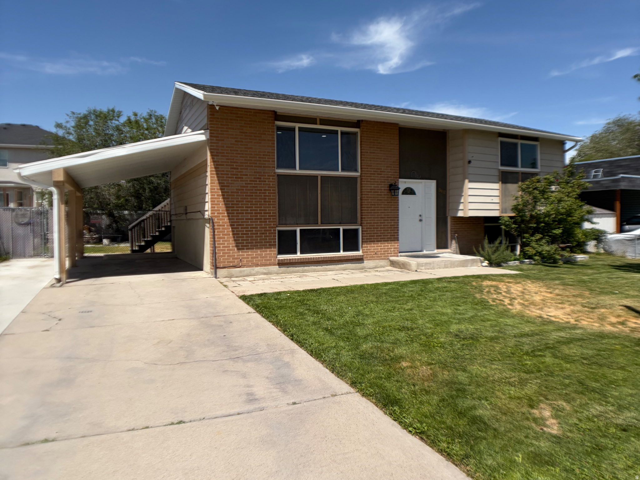 OPEN HOUSE 4TH OF JULY, 10AM-12PM! This Magna split-level delivers space, updates, and all the extras buyers actually want-at a price that won't last. Five bedrooms, an open-concept layout, and a walk-out basement make this home endlessly flexible: room to grow, space for guests, or built-in income potential. Step outside through French doors to a large covered deck and patio built for summer nights and easy entertaining. The fully fenced backyard checks every box: dog run, fire pit, and fruit trees (cherry in back, plum out front)-your own private retreat. Inside, thoughtful upgrades are everywhere: gas stove, reverse osmosis system, canned lighting, and a long list of major systems already replaced-newer A/C, furnace, roof, soffit, rain gutters, and carport. Plus expanded concrete parking for all your extra vehicles or toys. Unbeatable location with quick freeway access, minutes to Walmart, Rancho Market, and local restaurants. This one is move-in ready and priced to sell-don't wait!   Square footage figures are provided as a courtesy estimate only and were obtained from Tax records.  Buyer is advised to obtain an independent measurement.