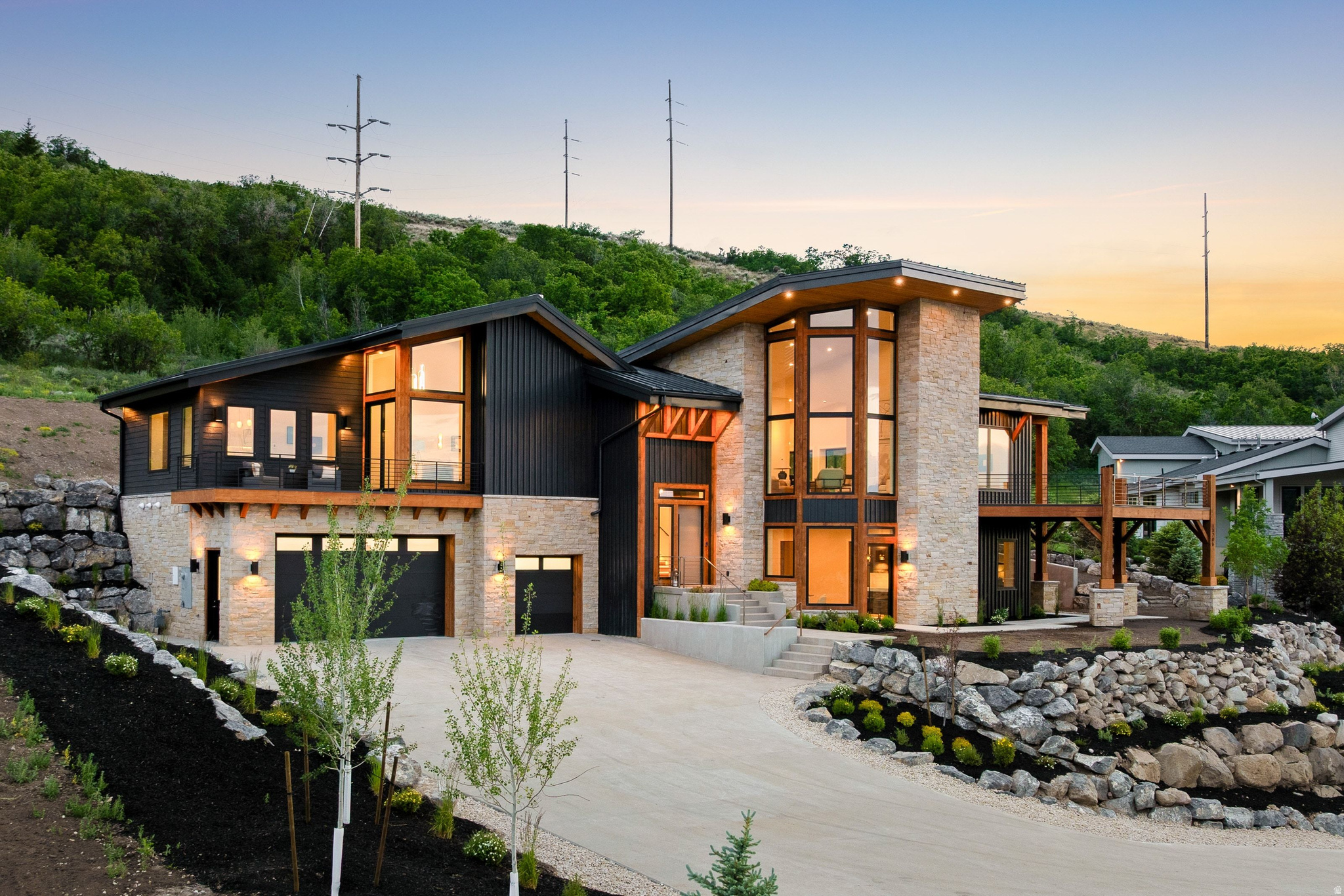 Located at the end of a quiet cul-de-sac, this home enjoys privacy, open space, and mountain views, offering a true sense of retreat just minutes from Deer Valley East Village, Jordanelle Reservoir, downtown Park City, and 35 minutes to Salt Lake City International Airport. The insulated concrete form construction is immediately apparent, making this home feel solid, incredibly quiet, and efficient. Inside, the vaulted ceilings and natural light create a sense of openness without feeling oversized. It's comfortable, livable, and well thought out.  The main-level primary suite with its own fireplace and private deck feels like a true escape, somewhere I can start the day slowly or unwind at night. The semi-formal dining area and bar makes hosting feel easy and natural, while the second family room with a large wet bar gives everyone space to spread out. Five bedrooms, including a custom bunk room, make it easy to imagine weekends filled with guests, kids bringing friends, and holidays that don't feel like a logistical exercise. The dedicated office gives me a place to focus when needed, though the views and the outdoor spaces are where it really starts to pull me in. Covered areas for shade, open areas for sun, and just enough room to actually use it all. The heated driveway is especially one of those features I didn't know I needed, and now can't imagine winter without it. The community checks the boxes I care about, with short-term rentals allowed for flexibility, plus access to a clubhouse with a pool, hot tub, gym, and theater. The 14-acre park and trail system nearby means there's always an easy escape into nature for a quick walk or bike ride, or a much longer adventure.