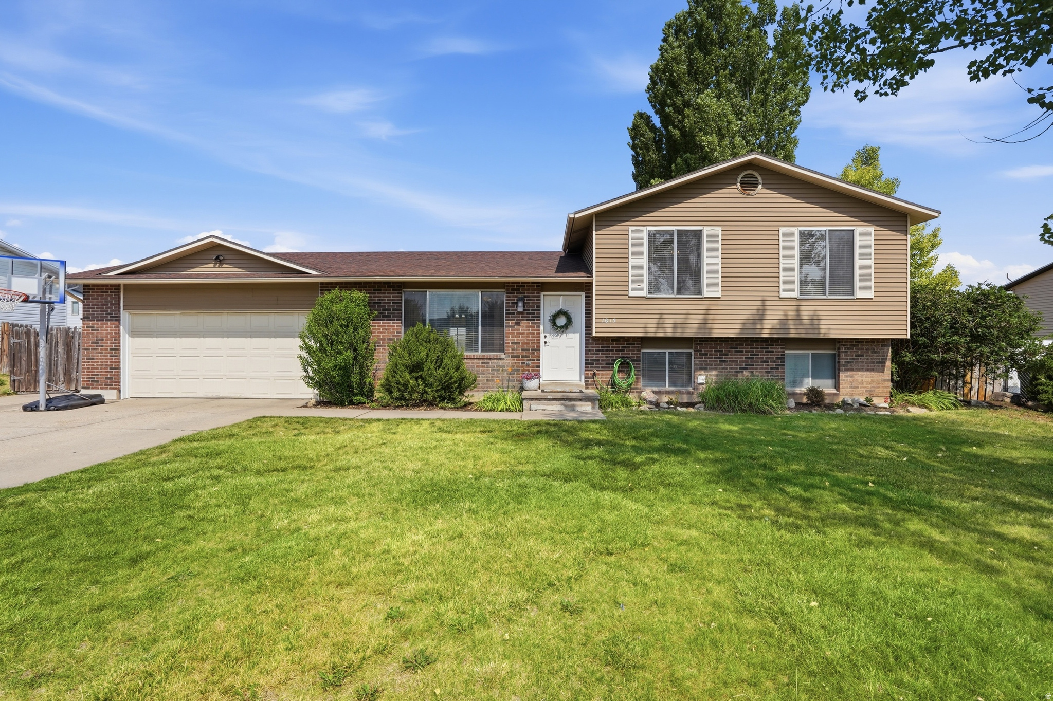 Tucked into a quiet, established Syracuse neighborhood, this multi-level home features new LVP flooring throughout the main level and a refreshed kitchen with newer appliances. The finished basement adds a 4th bedroom, second bathroom, and spacious rec room wired for surround sound. Big-ticket updates have already been completed within the last few years, including a new furnace, AC, water heater, and water softener. The 2-car attached garage offers tons of storage, plus a brand new garage door opener with built-in camera.  The large, fully fenced backyard is the showstopper, featuring a covered patio, fire pit, in-ground trampoline, and mature shade trees, plus an enormous 14'x45' RV pad secured behind the fence with additional parking out front. From easy walks to Founders Park, the splash pad, library, and pickleball courts, to quick access to shopping, dining, and the West Davis Corridor, this is a home where community and convenience come together.  Schedule your showing today!