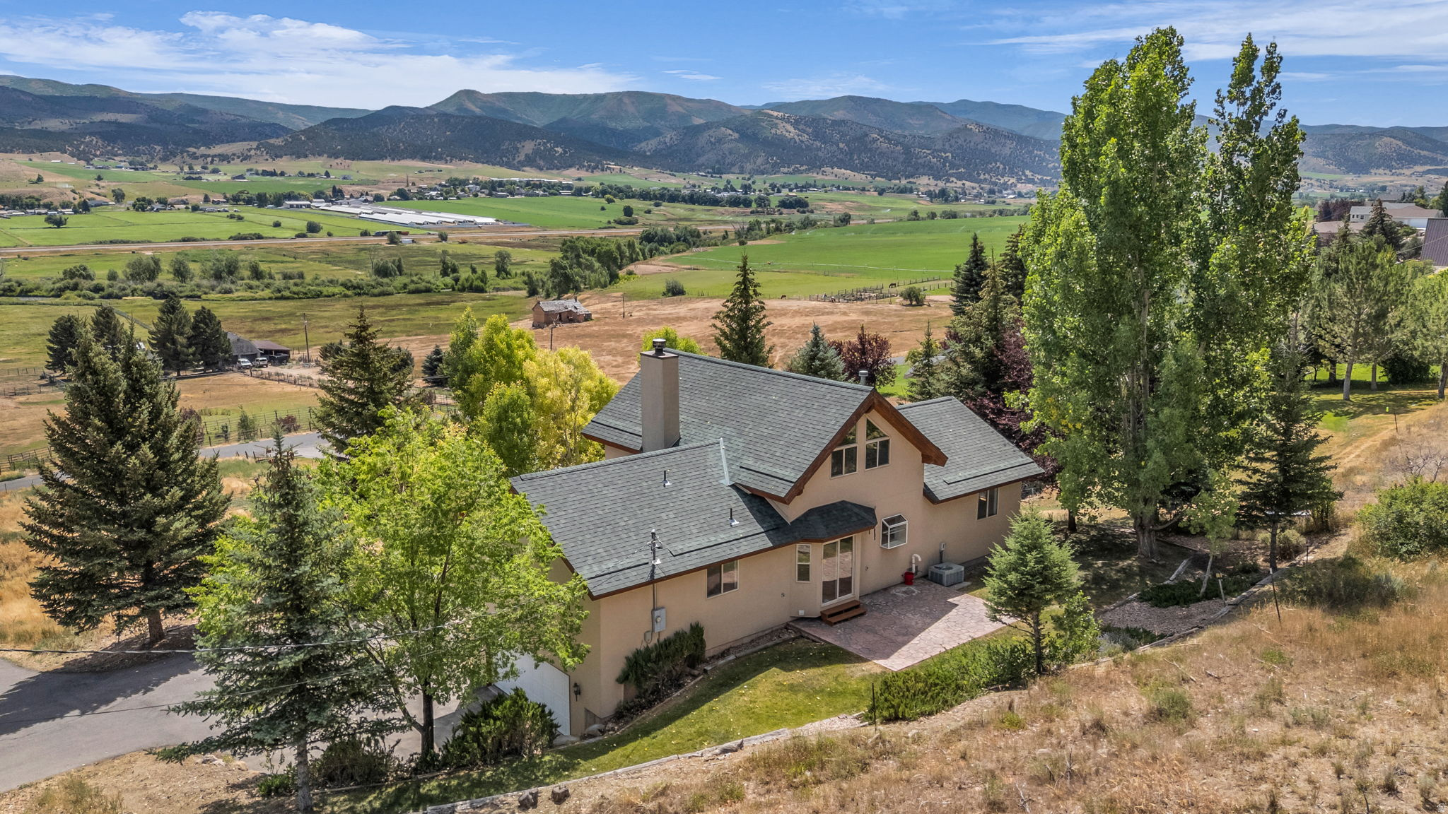 Come find wide open spaces and take in the view of the Coalville Valley and Western Slopes of the Uintas. This home boasts big windows to miss an inch of it. This charming 4 bedroom 2 bath sits in a coveted area of West Hoytsville on a very quiet road. It also plumbed for 3 bathroom in the basement. with 7+acres the options are endless to how you would like to love this property. Mature landscaping gives you a true hideaway in this quiet town that you will not want to miss out on. Only moments away from downtown Coalville and 25 minutes from Park City and world class ski resorts and dining. Both Echo and Rockport Reservoir bookend the valley so there is plenty of opportunity for recreation!