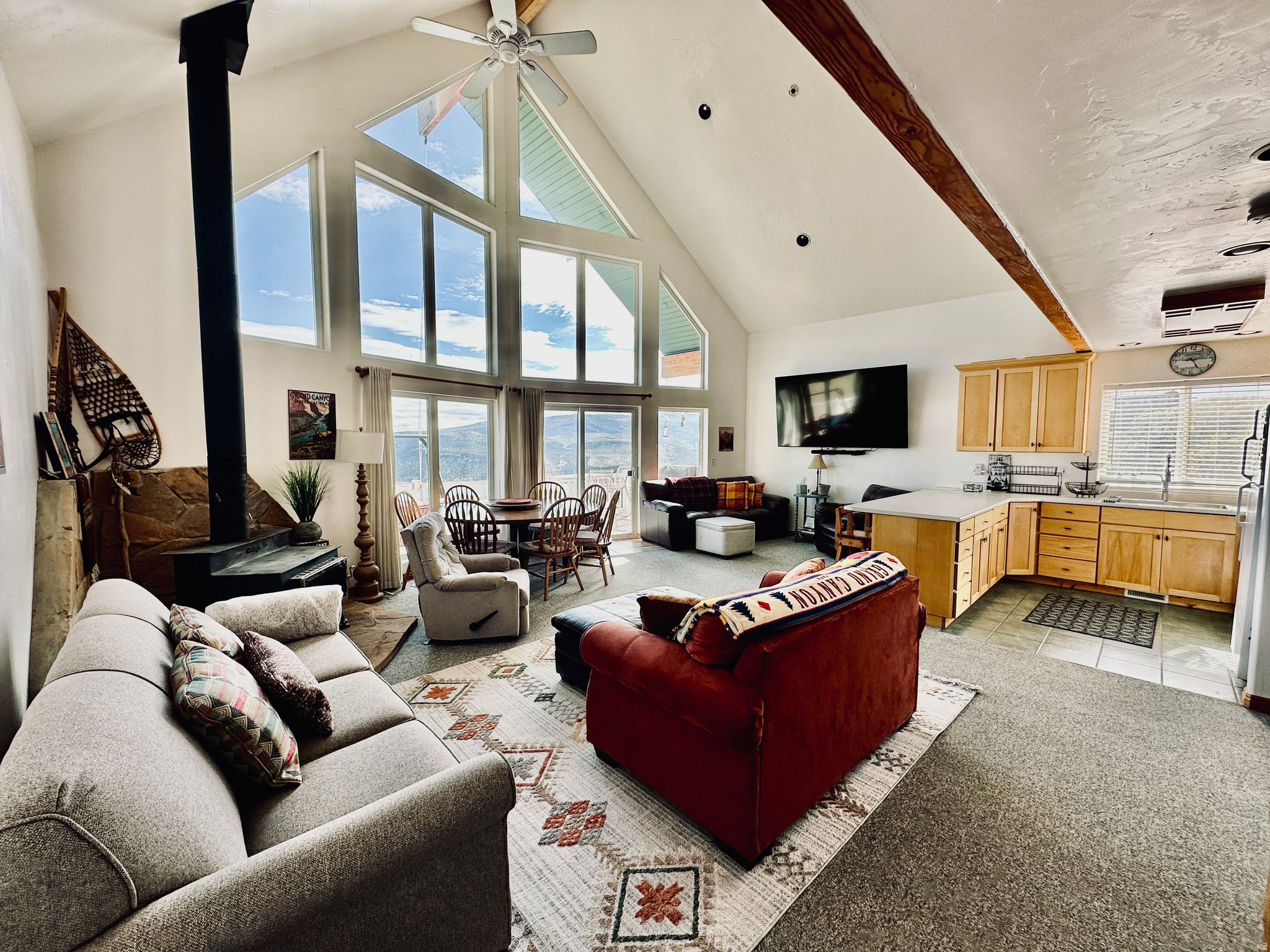 Beautifully maintained three-story mountain lodge on a private, wooded 1-acre lot in Lake Rockport Estates. Offers stunning panoramic views of Rockport Reservoir and surrounding mountains, including the Uinta National Forest. Features 3 bedrooms, 2 full bathrooms, and 3 separate living areas. Soaring vaulted ceilings, log cabin accents, expansive windows, central air conditioning, wood-burning stove, large deck, and fire pit. Fully furnished and move-in ready. Year-round access. Just 17 minutes to Park City and 40 minutes to Salt Lake City. Perfect for full-time residence or vacation home. Minutes to boating, fishing, hiking, skiing, and endless recreation. A rare opportunity for peaceful mountain living with modern comforts.