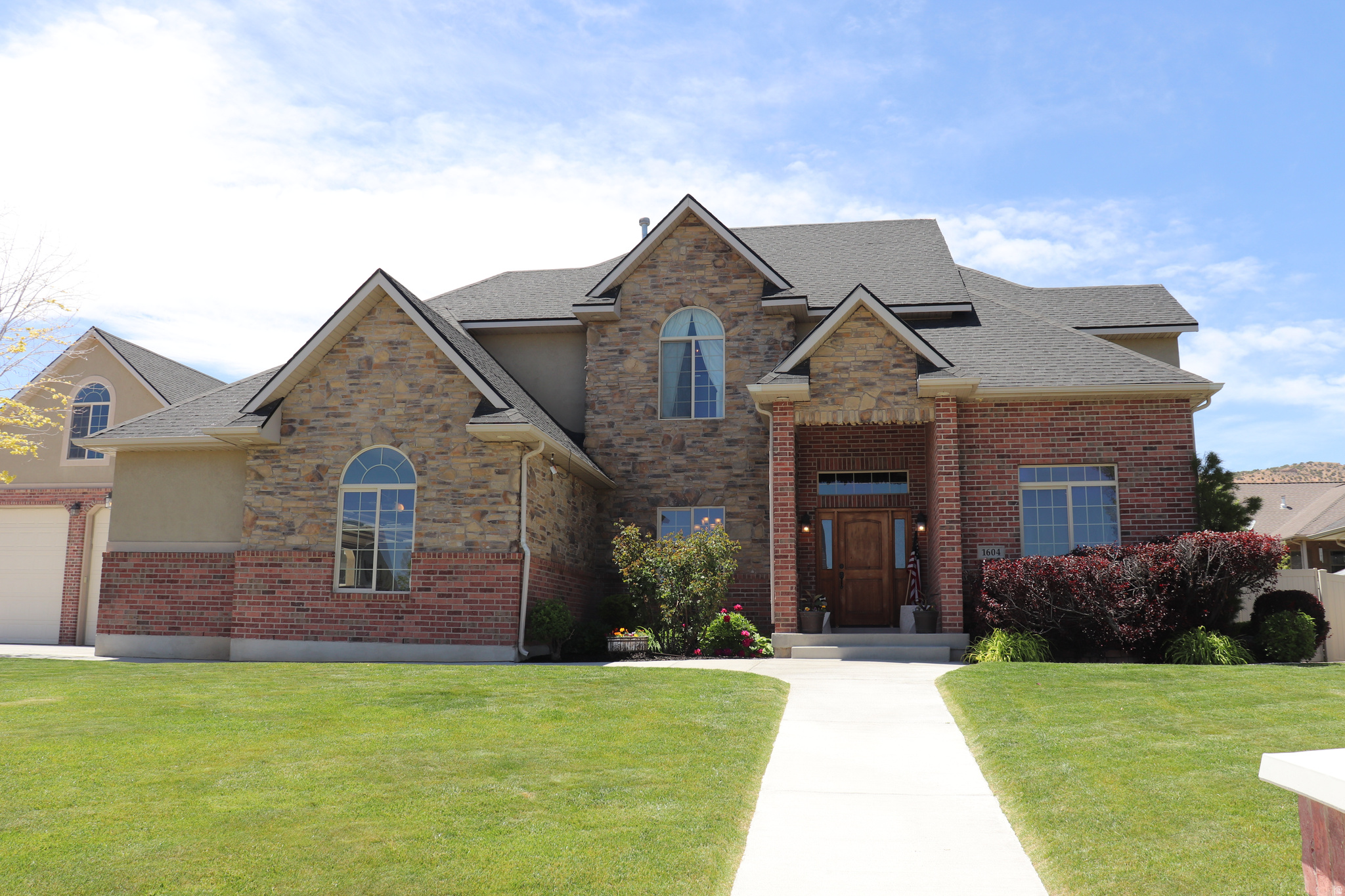 Step into this elegant but practical home located in Hidden Hollow.  This home and property is in immaculate condition and ready for you to move in!  So many features in this 5 bedroom home located in the desired Hidden Hollow Neighborhood. Private office area for your work at home, custom kitchen with granite and large bedrooms.  The basement features multiple rooms including large walk-in pantry and  a large theatre room with fully reclined seating for 9+.  Included are projector with screen and insane sound system and theatre lighting.  There is a game room with wet bar, sink, mini fridge, popcorn maker and ice machine to complete your theatre experience.  Step out on to the covered patio and enjoy the epoxy that makes cleaning a breeze.  This area includes a built in BBQ/burner/cold storage/trash and an updated granite kitchen island.  Outside features include an attached 2 car garage with epoxy floors and heat.  Large detached shop with heat,  50 amp plug and a huge storage area above which is fully painted.  Additional outside features include raised flower beds and mature fruit trees which have a plentiful yield.  There are Peach, plum and apple trees with raspberries also.  10x10 garden area , huge sand area (40x23) and plenty of RV/side by side parking.  This is definitely a must see for the qualified buyer.