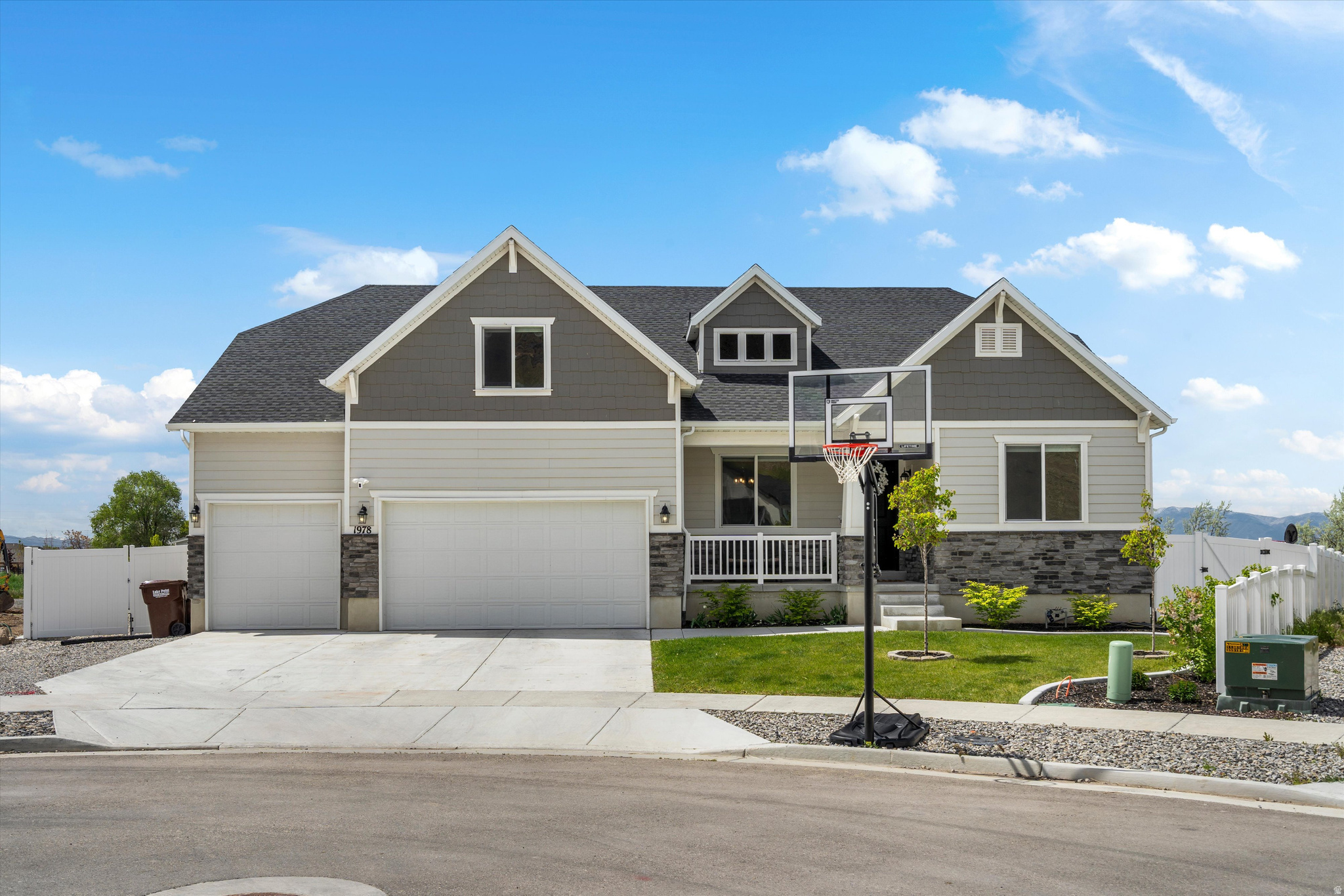 Built in 2023, this better-than-new Lake Point home offers a custom four-season sunroom designed for year-round enjoyment.  The home features a thoughtfully upgraded kitchen with quality finishes, along with a fully landscaped yard that's ready to enjoy. The backyard is fully fenced with double gates and includes space for RV parking (up to 30 feet), an in-ground trampoline, and a 12' x 16' Tuff Shed for additional storage. Inside and out, you'll find practical upgrades like custom window well covers with EZ Lift systems and overhead garage storage racks.  The backyard opens to protected green space with unobstructed views, creating a peaceful setting and beautiful sunsets.  Located in Lake Point, this home offers a quieter lifestyle with convenient access to everything you need-approximately 25 minutes to downtown Salt Lake City and about 35 minutes to the University of Utah and Research Park.  Move-in ready and thoughtfully finished, this home offers the benefits of new construction without the wait.