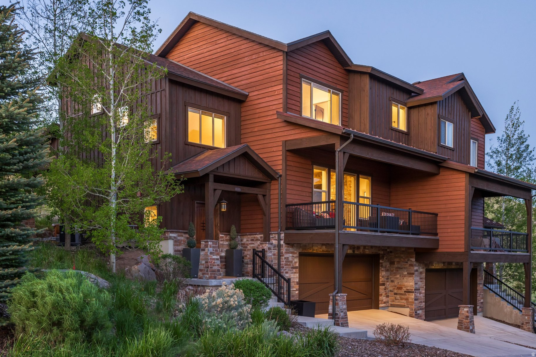 Welcome Home - to Rustler at Hideout, in the incorporated Town of Hideout - minutes from Park City offering the best of the best; location, views, convenience and serenity. Nestled into the uphill side of a quiet cul de sac, this impeccably maintained townhome feels spacious yet cozy with 4 beds/3.5 baths, boasting approximately 2,764 sf on three levels. Enter from the ample two car garage, beautifully built out with cabinets and epoxy flooring into the mud room and off to a private bedroom with ensuite bathroom on this lower entry level. Up one floor, arrive at the main living area, to the tastefully appointed kitchen/living/dining with an inviting open floor plan and upscale finishes throughout. A capacious front deck for sunset and beverages in the summer and back patio for grilling or just enjoying a quiet afternoon/evening after a fun day of partaking in the plethora of activities the area has to offer! The upper level features the primary bedroom with ensuite bathroom/walk in closet and views of Deer Valley and Timpanogos. Two additional bedrooms, plus laundry room complete this airy and modern feeling residence. Hideout is known for its legendary sunsets, wildlife sightings and peaceful stargazing evenings. The Park City area offers an abundance of summer and winter activities from art and music festivals, shopping and dining to hiking, biking, world class skiing, boating, golfing, blue ribbon fly fishing - the list goes on! Main St in Park City, Kimball Junction, Deer Valley and Park City ski resort(s) are all approximately 20 minutes away. Easy access to I-80 and Salt Lake International Airport about 40 minutes away, completes the 'convenience' package of this location - presenting an excellent opportunity for primary or second home investment in one of the most sought after regions in Utah