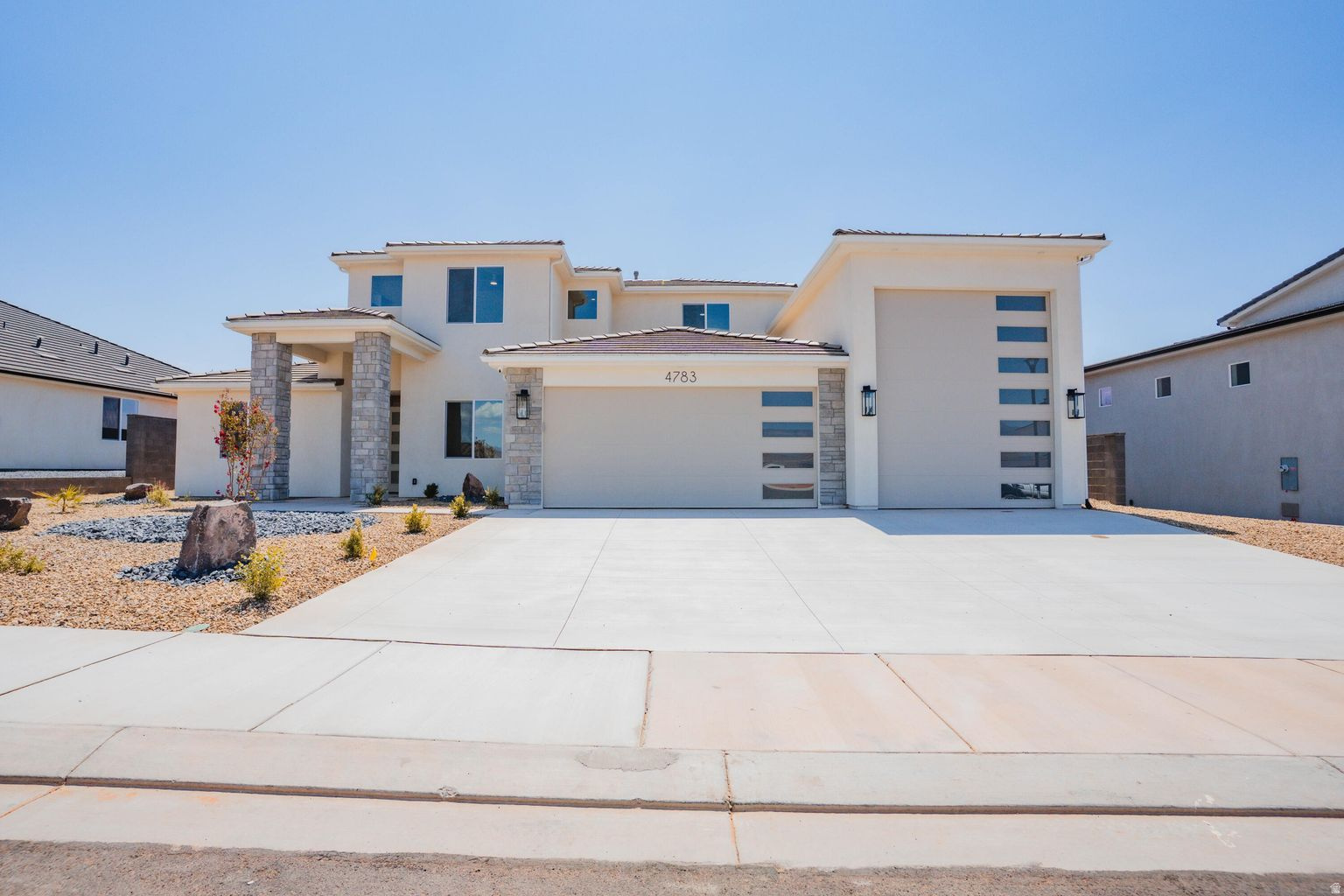 ~Recently Completed Custom Home near Sand Hollow~ This stunning 2 LEVEL home in Sand Hollow Village has a massive 52-FOOT DEEP RV GARAGE (12' wide x 14' tall door)! THIS IS IDEAL FOR: an adventure lover who needs a 52-ft deep RV garage for their toys, values luxury finishes, and wants to unwind in a spacious backyard just minutes from Sand Hollow's dunes and lake(ROOM FOR A POOL). This property comes equipped with premium SMART HOME features including 3 wired in insecurity cameras and a door bell camera. Just minutes from Sand Hollow Reservoir, Sand Hollow Golf Course, the sand dunes, and Zion National Park, you're surrounded by year-round adventure! Contact the Listing Agent for a private showing or to ask about additional incentives and options!