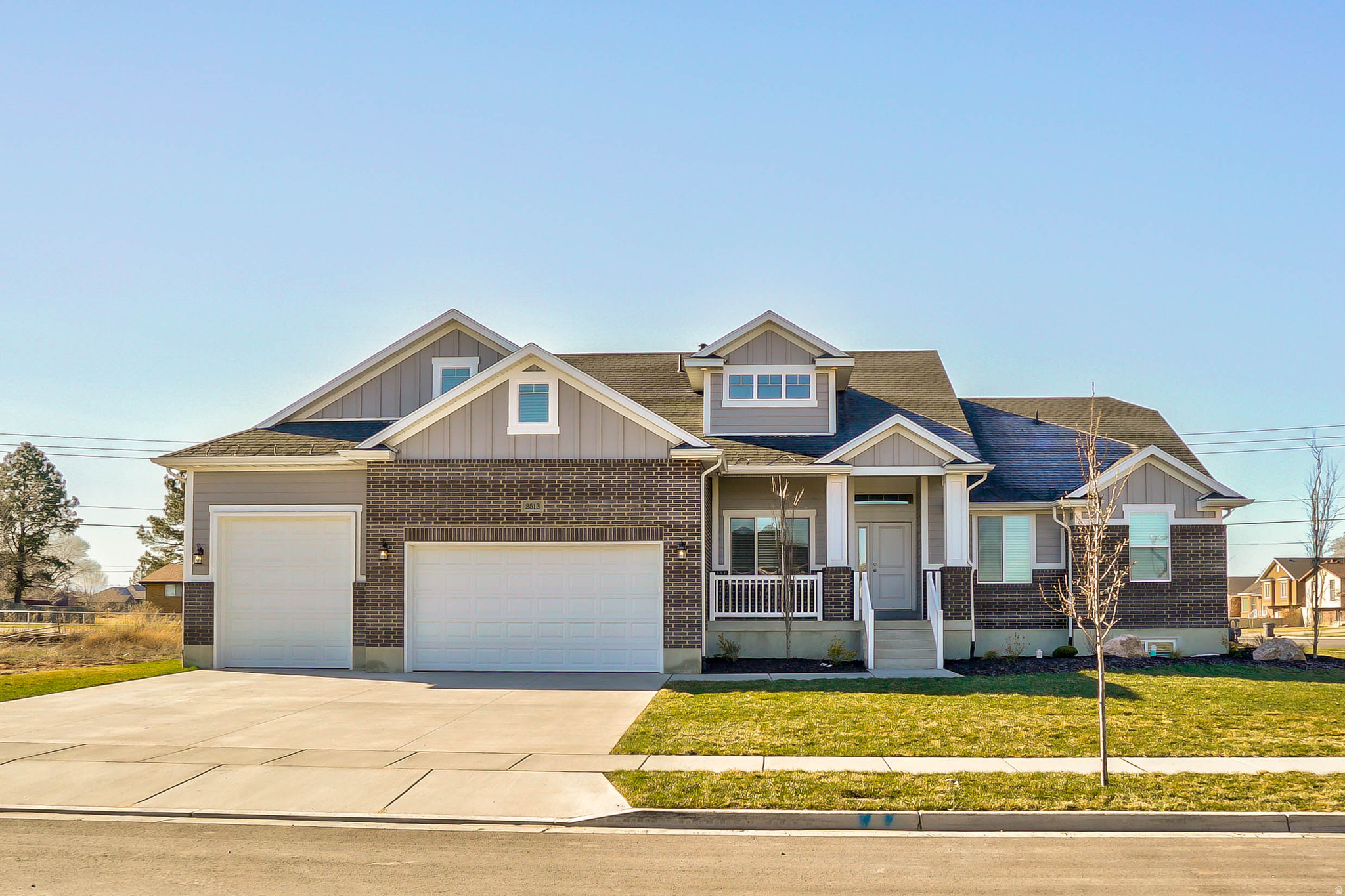 Rare opportunity to own a flagship Castle Creek model home in a highly sought-after community! Thoughtfully designed with custom touches throughout, this home blends a warm, inviting feel with a clean, modern aesthetic.  Soaring vaulted ceilings and abundant natural light create an immediate sense of openness. The front office features 10' ceilings, a large window, and a peaceful view-ideal for a quiet work-from-home space. The spacious owner's suite offers a true retreat with a soaker tub, oversized shower, and walk-in closet.  The expansive main living area features a seamless, open layout connecting the family room, dining, and kitchen-perfect for large gatherings and entertaining. Upstairs, a 520 sq. ft. bonus room provides flexible space for a media room, game room, or separate living area.  The partially finished basement includes two bedrooms and a bathroom, with additional space ready for a large family room, kitchenette, or extended living area-offering a great opportunity to build equity.  Set on a generous 0.37-acre lot, there's plenty of room to relax, play, and entertain. Enjoy evenings under the oversized covered patio, perfect for BBQs and gatherings.  Never lived in and used only as a model home, this like-new property offers exceptional value! Don't miss your chance to make it yours!