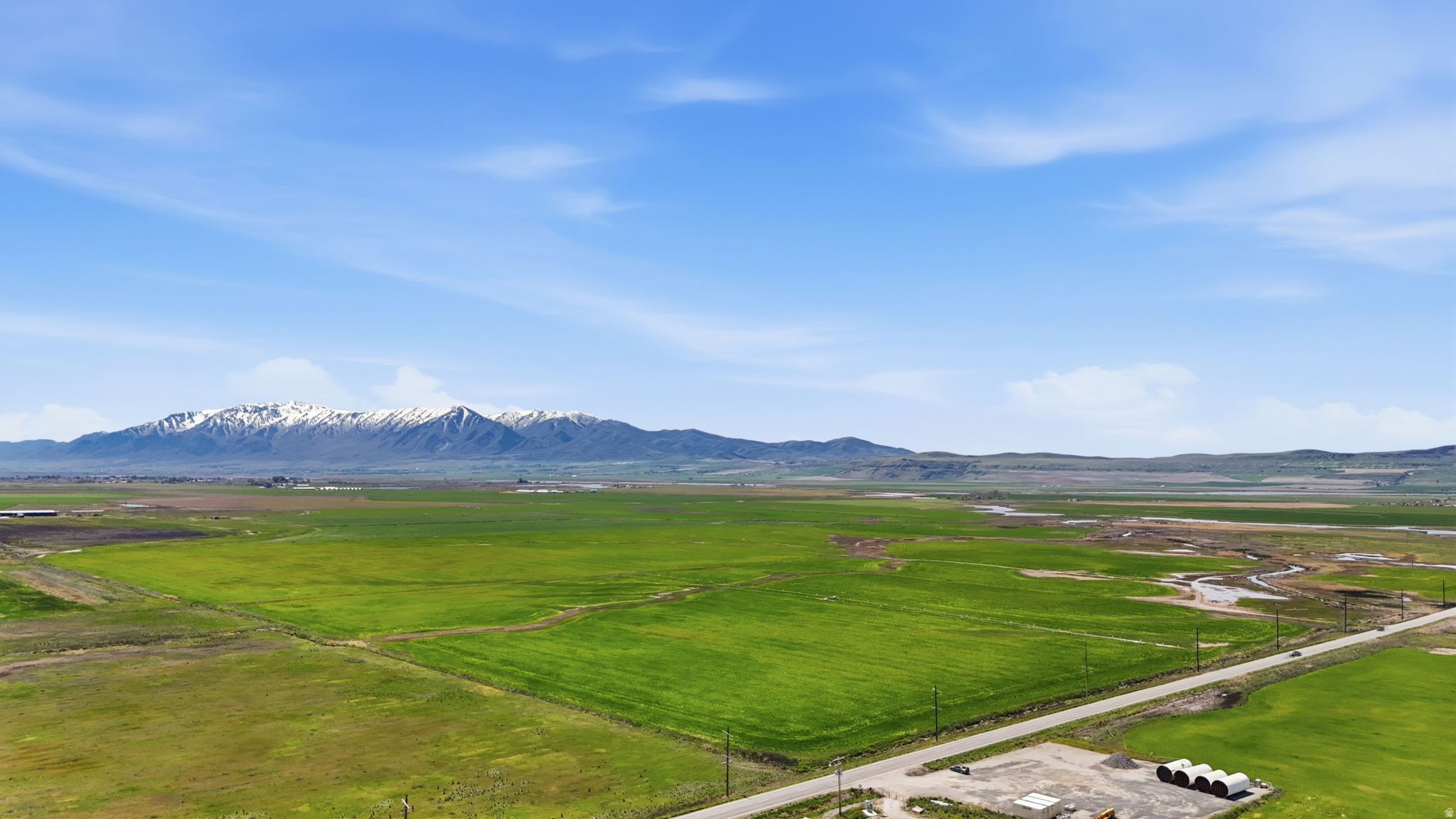 Incredible and productive irrigated farm ground! Power and highway frontage for potential residential or commercial use. Includes wheel lines. Views in all directions. With just a short drive to Smithfield this property is conveniently located. Includes water rights! This opportunity won't likely come around again.