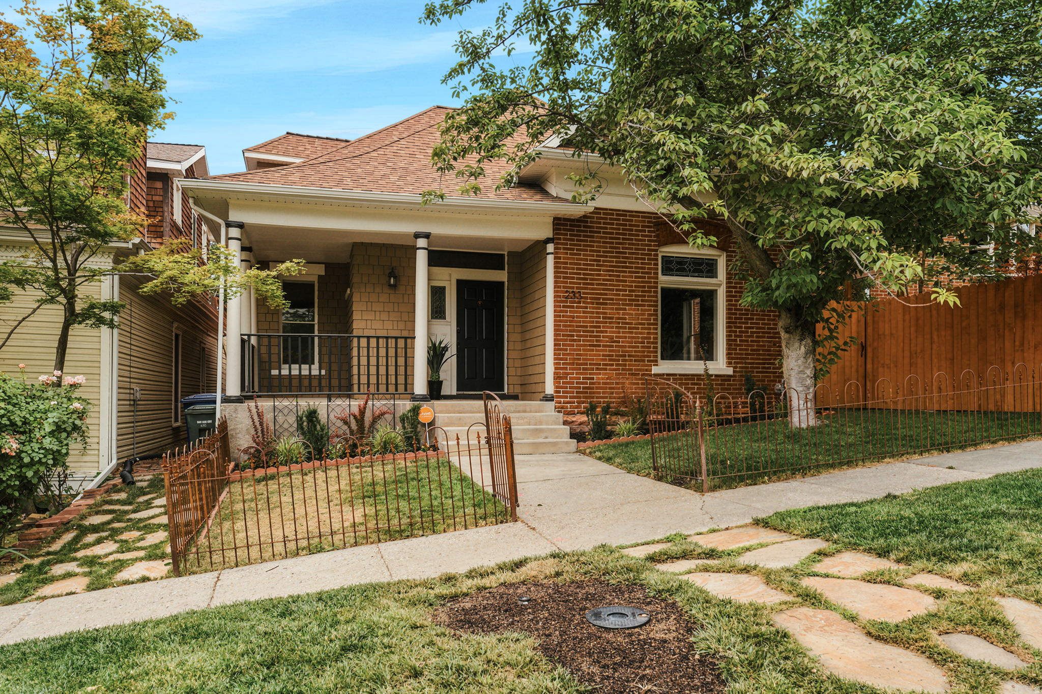 Downtown is minutes away. You'd never guess it from the backyard.  Built in 1896, 233 G Street has the kind of character the Avenues is known for and newer homes spend a fortune trying to fake. Brick, wood trim, and hardwood floors. More than a century of character that still feels good to live in.   Inside, the character has been preserved rather than stripped out, paired with the 21st-century updates that actually matter. A French countryside kitchen, warm and timeless without trying too hard. The primary is a genuine retreat with a beautiful en suite. And there's real storage throughout, including a basement that gives you more room than most homes from this era.  It's easy to be in, the kind of place made for slow mornings and a book by the fire. Out back is the rare find for this part of town: a fully gated, private yard with garden and off-street parking, all tucked behind the same fence.  And you're in the middle of everything. Dinner at Wildwood, coffee at Publik, groceries around the corner, the Capitol and downtown just down the hill. City living, without the noise.  Homes like this in the Avenues don't come up often. Come see it in person.  Square footage figures are provided as a courtesy estimate only and were obtained from county records .  Buyer is advised to obtain an independent measurement.