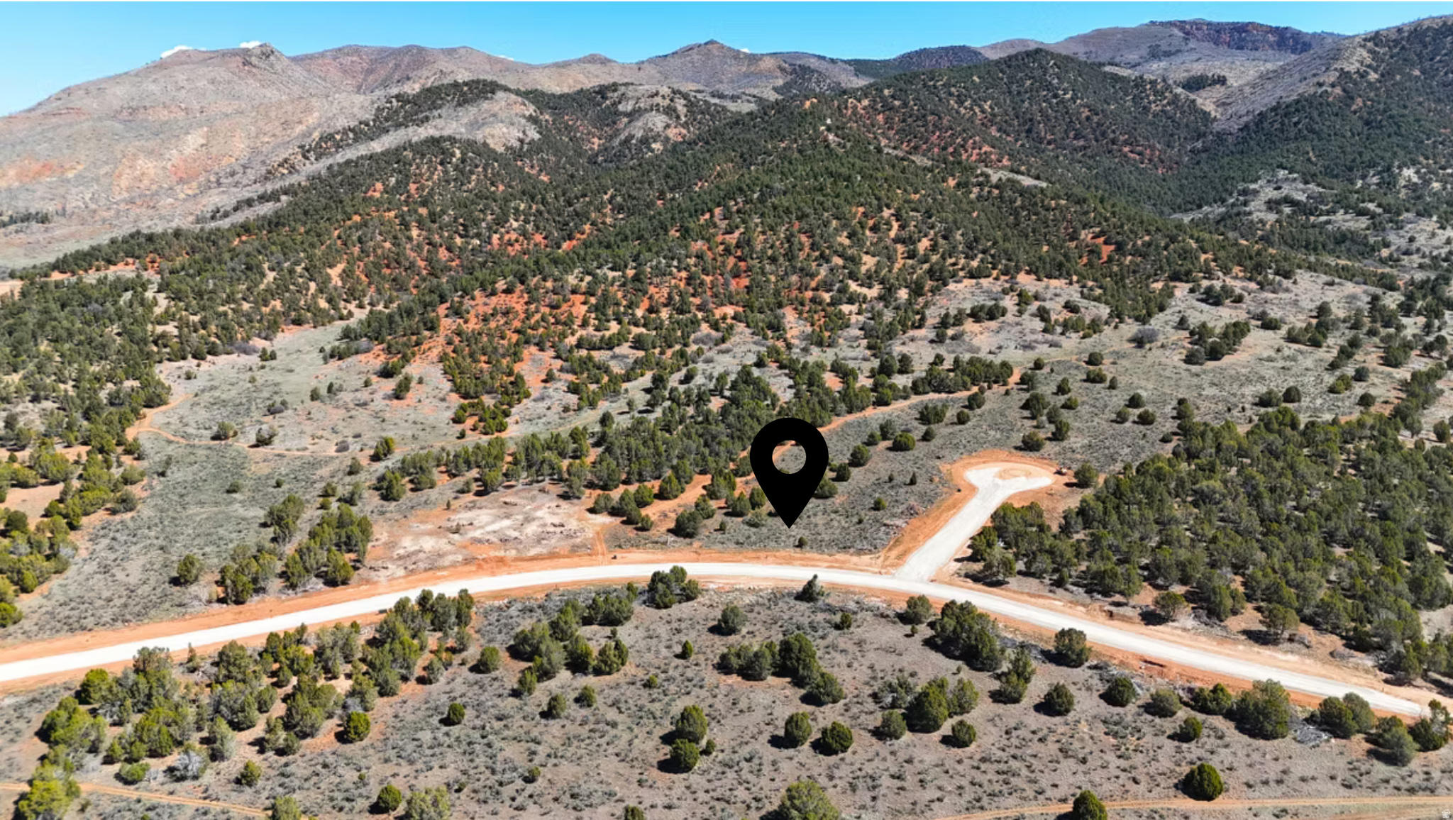 Meet Lot #33 in Eagles Landing - a beautiful 1-acre lot nestled behind Loafer Mountain, where the surrounding terrain naturally shields residents from winter inversions and harsh temperatures. Bordering BLM land and over 200 acres of open space, with a trail system to the east connecting to thousands of square miles of public lands, this lot is an outdoor enthusiast's dream. Electricity and water are already stubbed to the lot, so you can hit the ground running on your custom home build. Road work and gas utility installation are both projected to be complete soon, putting every utility you need within reach. And if acreage is on your wish list, Lots 33 and 34 are available to be purchased together - nearly 2 acres in one of the area's most unique mountain communities. Eagles Landing is a self-sustaining community with its own private water source and storage, offering the perfect balance of natural beauty and modern convenience. Shopping, dining, a hospital, a golf course, and a movie theater are all within 20 minutes. If you've been dreaming of building a custom home in a pristine mountain setting, Lot #33 in Eagles Landing is your opportunity. Schedule a tour today.