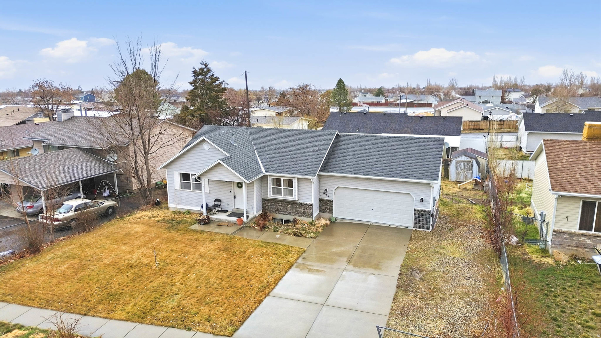 Ready to move in home.  Main floor and basement each have 2 bedrooms and a bathroom.  Has a deck leading into the back yard.  Small storage shed in the back yard.  Plenty of parking in the long driveway and 2 car garage.  New roof in 2020. Square footage figures are provided as a courtesy estimate only and were obtained from County Tax Records.  Buyer is advised to obtain an independent measurement.