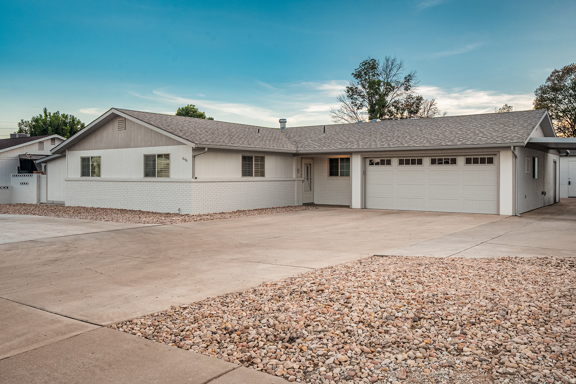 Classic St. George charm meets modern updates in this beautifully refreshed 4-bedroom + den, 2.5-bath home, ideally located just minutes from the university, hospital, shopping, and everyday conveniences. Inside, you'll find fresh paint, new carpet, a spacious kitchen with a large island, new Bosch appliances (refrigerator included), and convenient roll-out wire shelving. The remodeled primary suite features a stunning primary bathroom, and two large walk-in closets. Bedroom 4 and the den each offer private exterior entrances, creating flexible space for guests or a home office. Thoughtful upgrades continue throughout with plantation shutters, a skylight that brightens the kitchen and dining area, double-pane windows (new in 2005), and a private pet entrance. The finished garage is climate-controlled with central air and includes epoxy flooring, a new oversized 17' garage door with 100,000-cycle springs, and a smartphone garage door opener. Outside, enjoy a fully fenced yard, circular driveway, abundant parking, two-car garage, carport, RV parking, automatic sprinklers (in back), drip irrigation (in front) for future trees or shrubs, and a detached workshop complete with power and lighting. Exceptionally well-insulated, this home offers comfort, efficiency, and timeless appeal in one of St. George's most convenient locations.