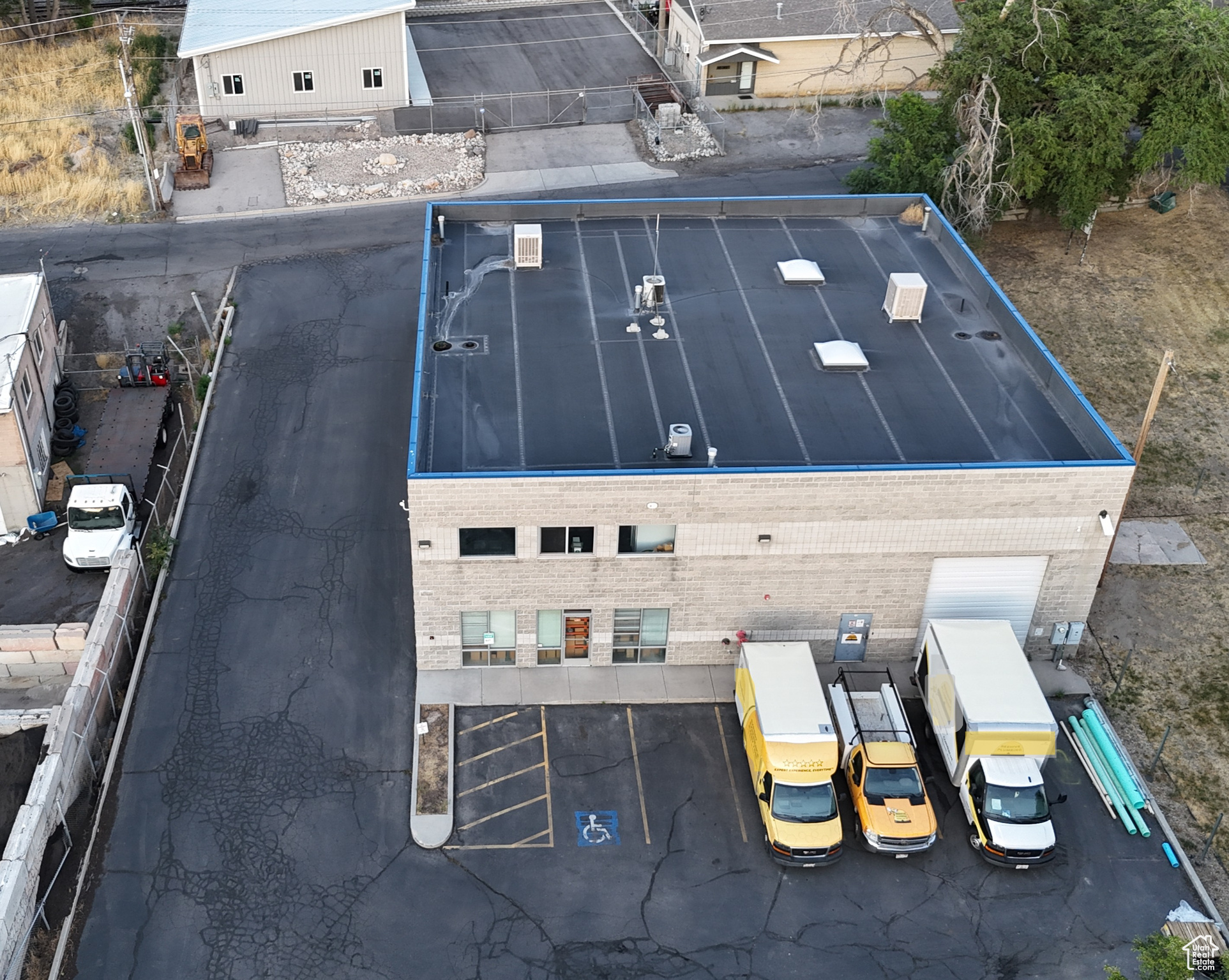 The warehouse is heated and cooled. Main ground level has two offices and two bathrooms (one has a shower). Top office level is a large open conference room. Second level office space could easily be changed to create additional offices or smaller conference rooms. Separate private/side entrance that leads into the upper office/conference room. Additional 5/6 parking spots in front of building to the East next to mail box (not included in parking count).   Inside office construction is a couple years old. The building envelope is 0.12 but the common site is 0.64, therefore the allocated total size of the site is 0.333 acres or 14,505 square fee. Plenty of parking, 14 allocated stalls. Warehouse ceiling height is 21'. Fire Suppression System is installed.  Warehouse power: 250 Amp 480 Volt & 250 Amp Volt 3-Phase Power. Plenty of open warehouse space that could be converted to office space.
