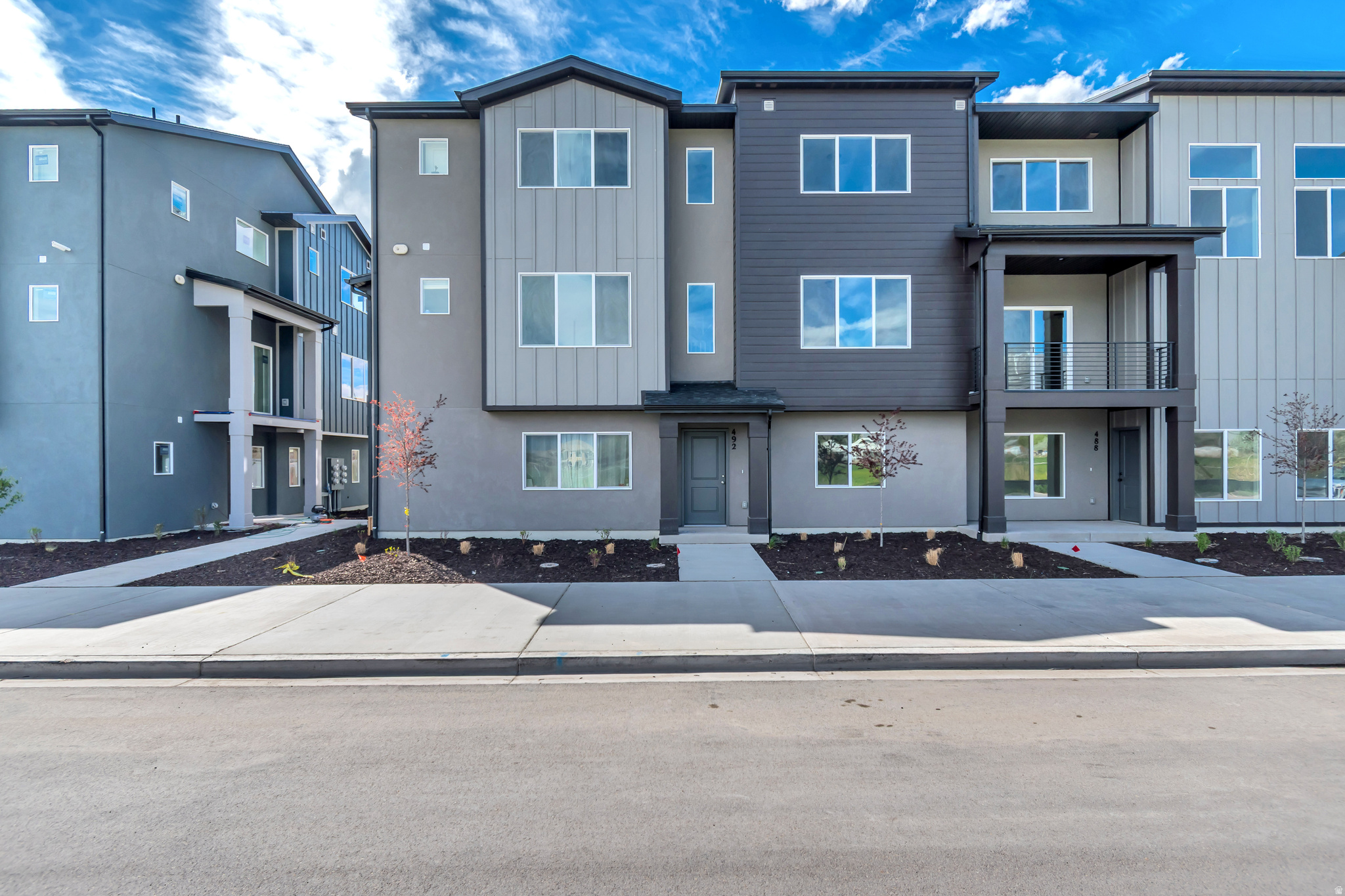 VIEWS & VIEWS!!! Welcome to your brand new Woodside Homes Townhome. This Hillsborough plan is one of the few facing East with amazing Views of Timp.  An office on the first floor is perfect for those working from home, with a spacious second floor great for entertaining. 9' Ceilings on the second floor, upgraded 2-tone cabinetry, with quartz countertops, gas range, waterproof wood laminate flooring, and stained open railing, make this an incredible value you don't want to miss. Dual Sinks in the primary bathroom, with a generously sized walk-in-closet are just a few of the thoughtfully designed features in this home. Located in a highly coveted area in American Fork, close to front runner, freeway access, shopping & more, this is the perfect home for you!  Ask about our AMAZING preferred lender incentives/special rate promotions to help make your dream of homeownership a reality.  #445 Hillsborough.