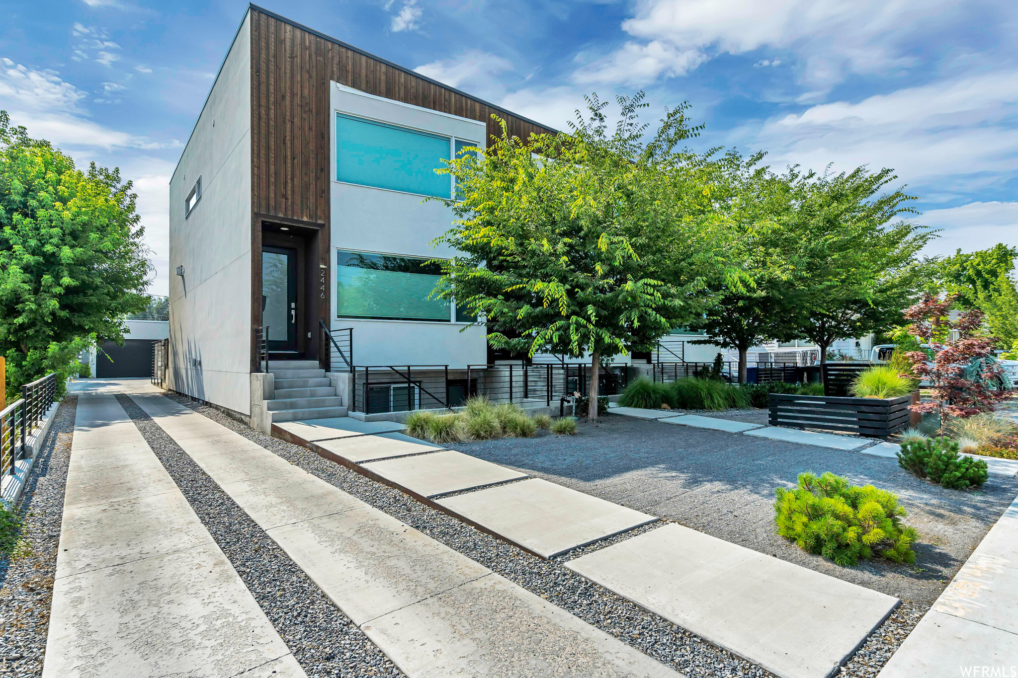 Experience elevated city living in this modern 4-bedroom, 4-bath rowhome located in the heart of Sugar House. Designed for luxury and functionality, the home features hardwood floors, high ceilings, mountain views, and three fireplaces, creating warm, light-filled spaces throughout. Enjoy indoor and outdoor living in the front and backyard spaces, featuring beautifully designed landscaping with a full drip irrigation system and custom-welded steel fence with matching garden beds, hot tub, and two-car garage. This home is packed with premium smart and mechanical upgrades, including a whole-home hardwired Sonos sound system, solar panels with Tesla battery, security system, multi-level HVAC zoning. The basement ADU, located on the lower level of this three-story rowhome, features a private entrance and full-size windows that flood both the living room and bedrooms with natural light. Ideal for a mother-in-law suite, extended family, or rental income. It is currently operating as a profitable short-term rental. Unbeatable location: walking distance to Fairmont Park and just minutes from the restaurants, cafes, breweries, bars, and shops of downtown Sugar House, including Whole Foods, Barry's Bootcamp, Target, and many more conveniences. Enjoy easy freeway access with a 5-minute drive to the University of Utah, 10 minutes to downtown Salt Lake City, 15 minutes to the airport, and 20 minutes to world-class ski resorts. No HOA. A rare opportunity to own a luxury, low-maintenance home that delivers the energy of city living with the comforts of a high-end retreat. Perfect as a primary residence, getaway, or income-producing property.