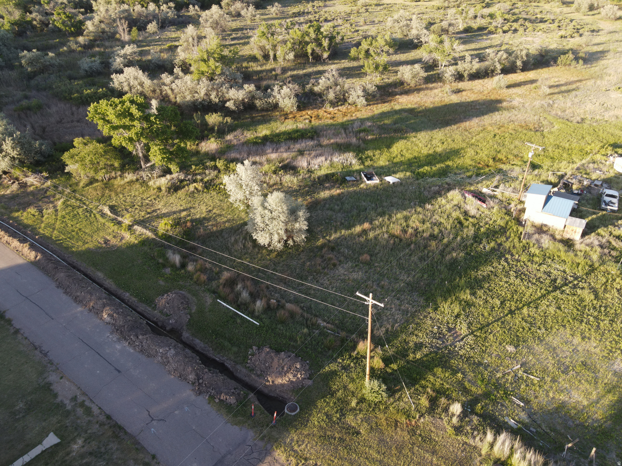 Rare opportunity to own a spacious 0.50-acre lot in the heart of Myton. Tucked near the end of a quiet street, this property offers a peaceful setting with added privacy from the open land located directly behind the lot. Utilities are conveniently nearby, and sellers have been informed that water and sewer connection fees have been paid; buyer is advised to verify all utility availability and connection information. With its generous size, desirable location, and scenic surroundings, this is an excellent site to build your dream home. Buyer to verify all.