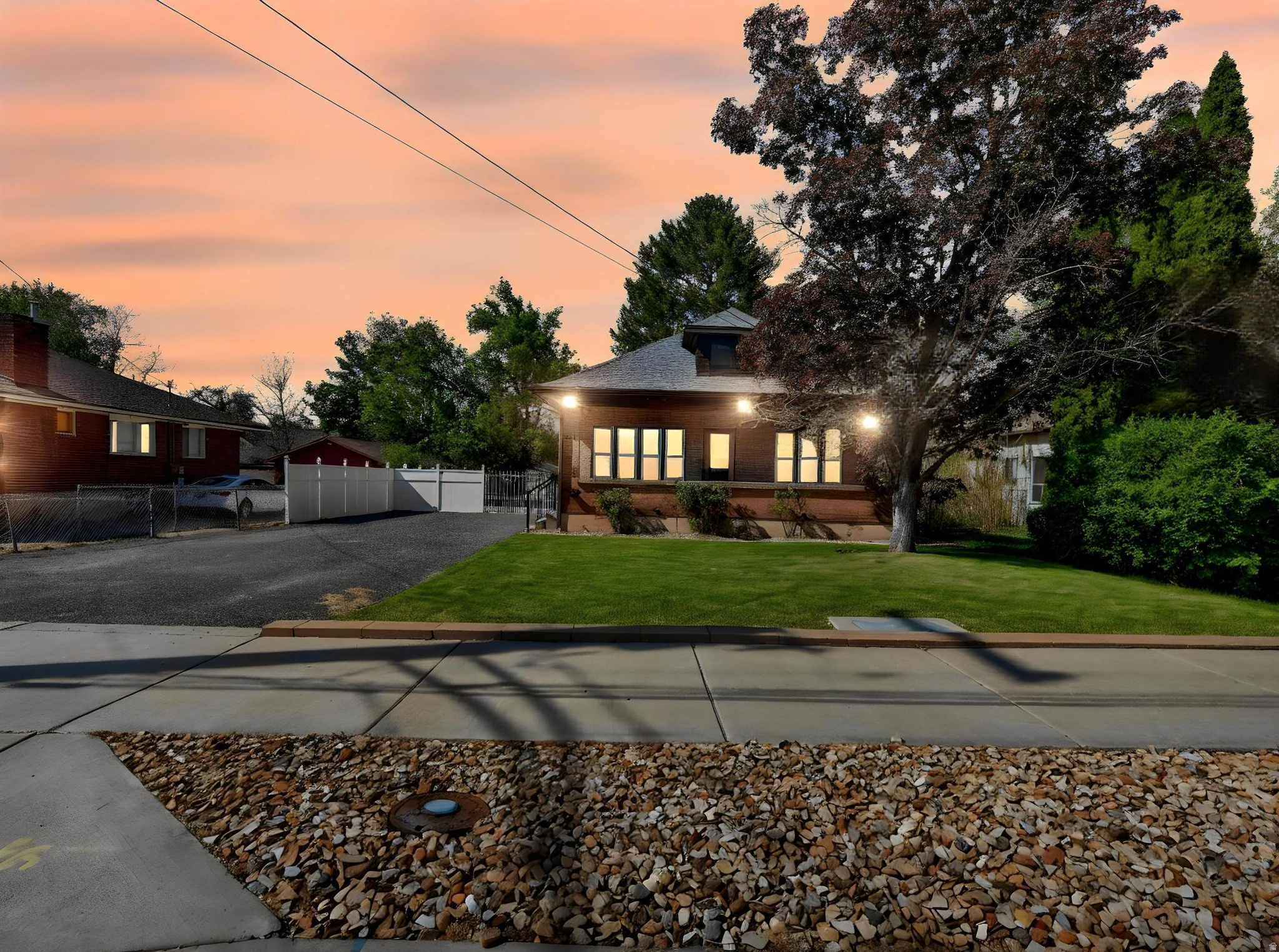 Classic charm, thoughtful updates, and timeless character come together in this beautifully maintained bungalow cottage in the heart of Ogden. Rich original woodwork, stunning coffered ceilings, hardwood floors, and oversized windows create warmth and character that are hard to find in today's homes. The spacious living and formal dining areas offer the perfect blend of historic craftsmanship and everyday comfort.  The updated kitchen features granite countertops, custom cabinetry, stainless steel appliances, and a functional island designed for gathering and entertaining. The bathroom has been tastefully updated while still complementing the home's vintage appeal.  Outside, the fully fenced yard offers mature trees, mountain views, and plenty of space to relax, garden, or entertain. The long driveway and gated access provide ample parking and flexibility. An unfinished basement adds additional storage or future expansion potential.  Conveniently located near downtown Ogden, parks, trails, shopping, and dining, this home offers character, functionality, and location all in one. Although this is a Short Sale, the great news is that it's through with Utah Housing which means that it only takes a few weeks longer than a normal purchase.