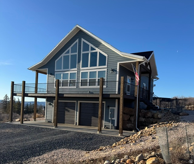 Experience the tranquility of lakeside living with this newer home offering unparalleled views of both the lake and mountains. Imagine waking up to breathtaking scenery, cooking in your top-of-the-line kitchen with double ovens, and enjoying the warmth of a gas fireplace in your spacious, vaulted-ceiling living room.  This home offers main floor living.  The fully finished walk-out basement is perfect for entertaining or relaxing after a day of ATV trails, hiking, or biking. Close to the golf course and minutes from ideal beach access, this home is your perfect getaway or year-round retreat at the lake.    Pass to Ideal Beach available for the amenities.