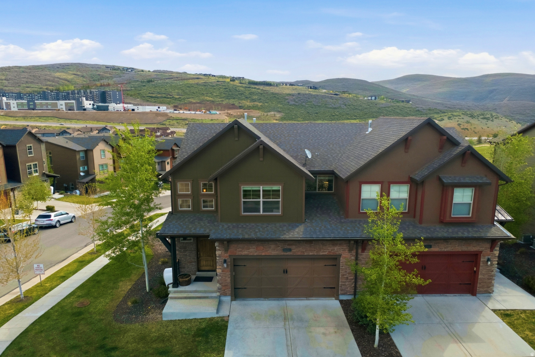 Located in the sought-after Retreat at Jordanelle community, 1088 W Abigail Drive offers 4 bedrooms, 3.5 bathrooms, and nearly 2,700 square feet of well-designed living space. This corner-lot townhome creates a quiet and scenic setting just minutes from Deer Valley East Village, Jordanelle Reservoir, and Park City. The main level features an open living, kitchen, and dining area centered around a cozy fireplace, with hardwood floors and a spacious kitchen island ideal for gathering and entertaining. The upper level includes a generous primary suite with walk-in closet, two additional bedrooms, and convenient laundry. The walk-out lower level adds a second living area, fourth bedroom, and another bath-perfect for guests or flexible living. Enjoy mountain air from the private deck or patio. Nightly rentals are allowed, making this a great option for a primary home, vacation property, or investment.
