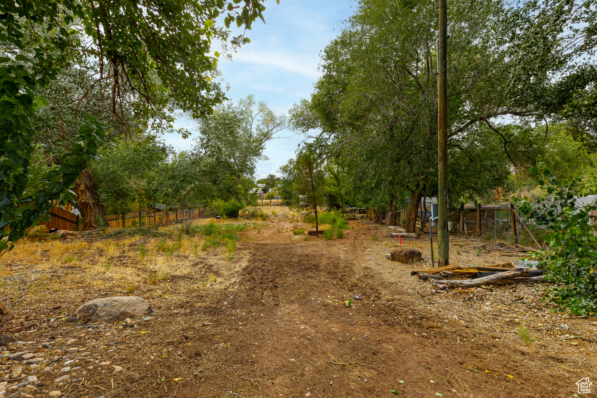 MOTIVATED SELLER!! Discover Your Private Slice of Paradise in Virgin, UT  This parcel in Virgin, just minutes from Zion National Park, offers a rare opportunity to create a residence surrounded by natural beauty. The lot includes mature trees, open space ready for development, and panoramic views of the surrounding hills and skies. While a portion of the property lies within the floodplain, there are conventional, standard methods to comply with floodplain zoning-solutions that are straightforward and not expected to create costly complications.  The setting delivers a calm, spacious atmosphere with convenient access to nearby amenities. Utilities are close by, adding to the site's readiness for development. Whether you're looking to build soon or hold as an investment, this property offers flexibility and long-term potential. With its combination of natural features and utility access, it's an ideal foundation for your next chapter in Southern Utah.