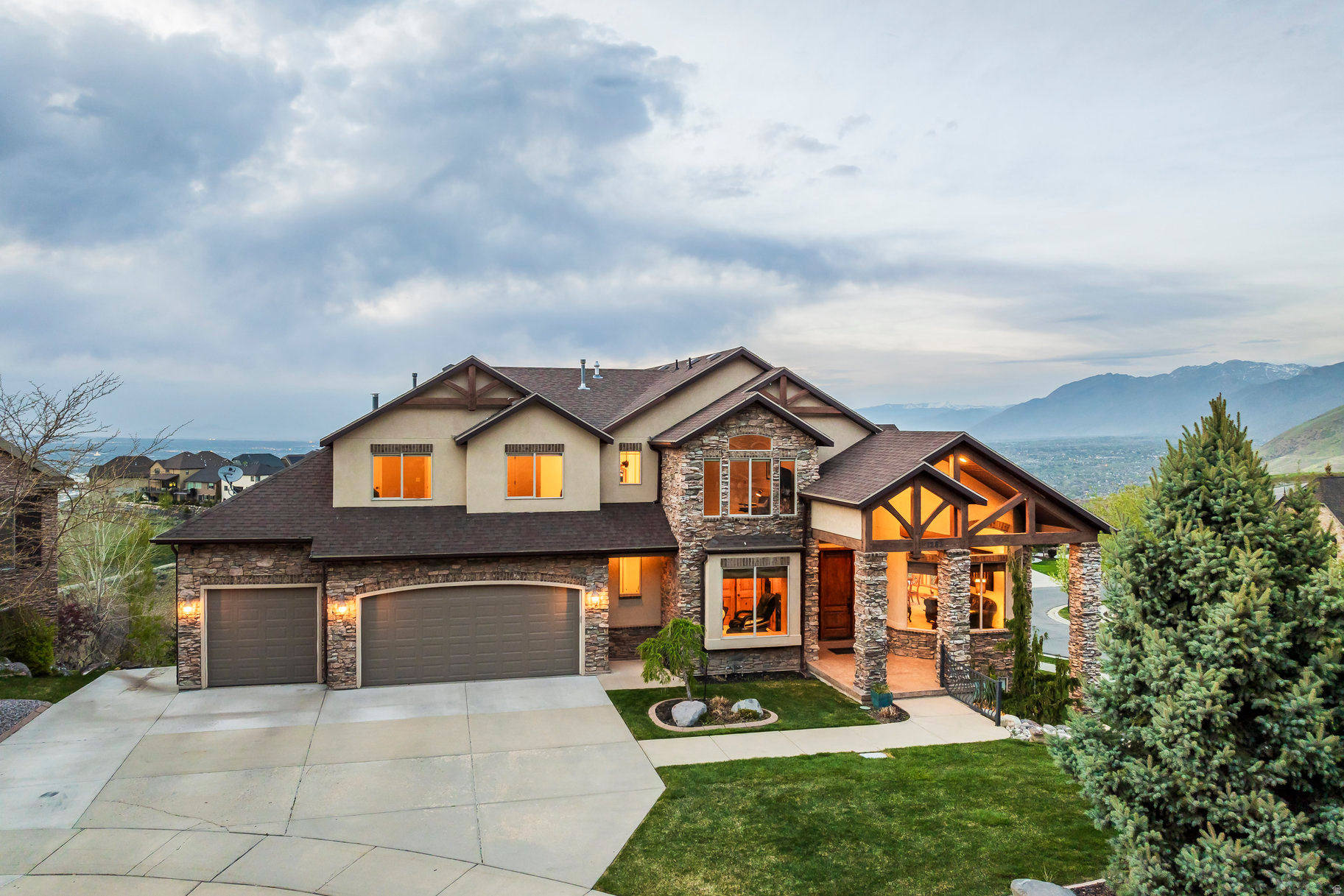 This stunning custom two-story home is perfectly nestled in the highly sought-after Ridgewood community on Draper's East Bench. Thoughtfully designed for both grand entertaining and everyday living, it features 7 bedrooms, 6 bathrooms, and multiple spacious gathering areas. The gourmet kitchen is a chef's dream, while the fully finished basement-with its own second kitchen-offers the perfect setup for guests or multi-generational living. Architectural highlights include soaring exposed wood beams, custom hardwood floors and doors, and elegant Tuscan-inspired finishes throughout. Expansive windows frame spectacular panoramic views of the Salt Lake Valley and surrounding mountains, creating a serene backdrop from nearly every room. The home also boasts a 4-car garage and a beautifully landscaped lot measuring just under half an acre (.34 acres), designed for both beauty and functionality. Residents enjoy direct neighborhood access to Draper's coveted Corner Canyon Trail System-ideal for hiking, biking, and outdoor adventures-along with close proximity to excellent shopping, dining, and the Draper Temple. With easy freeway access and a prime location approximately halfway between Salt Lake City and Provo, this home offers the perfect blend of luxury, convenience, and natural beauty.