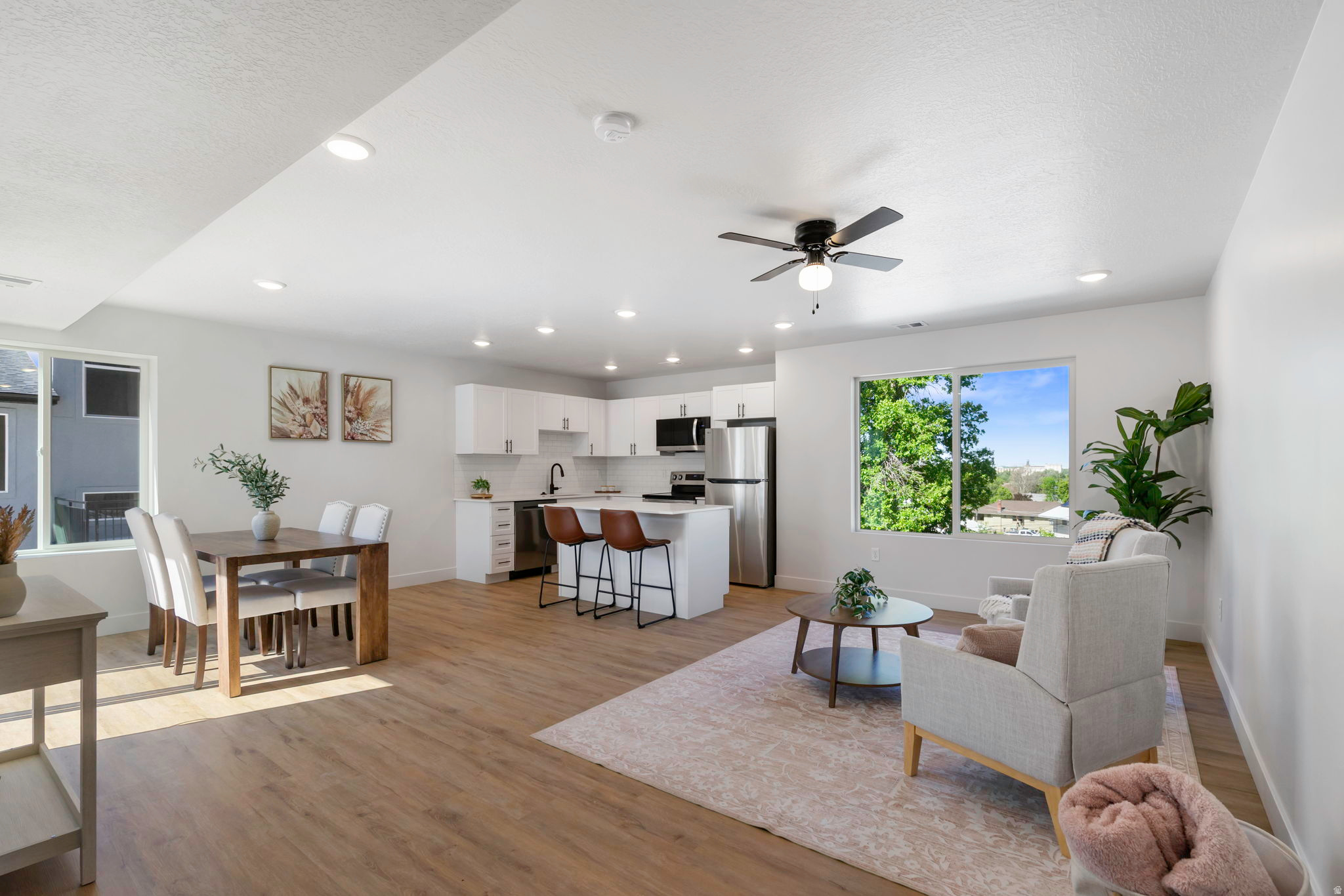 Tucked just off the street, Sycamore Townhomes offer a rare combination of peace, natural light, and a functional layout. This brand-new 2-bedroom home is designed for everyday living. The main floor features an open and airy layout. Upstairs, both bedrooms and the laundry are conveniently located together, making daily routines simple and efficient. Washer and dryer are included, adding immediate value and ease on move-in day. Natural light fills the home, highlighting clean finishes and durable laminate flooring throughout. This home includes a 2-car garage that is wired for an EV Charger and is positioned in a quieter setting away from main road traffic. Residents can also enjoy a shared grassy picnic area, perfect for relaxing or gathering. Conveniently located near the high school, restaurants, a grocery store, and a gas station, these townhomes offer both comfort and accessibility in one well-designed package. There are 7 townhomes available with 2 or 3 bedrooms. Contact Kim for more info.