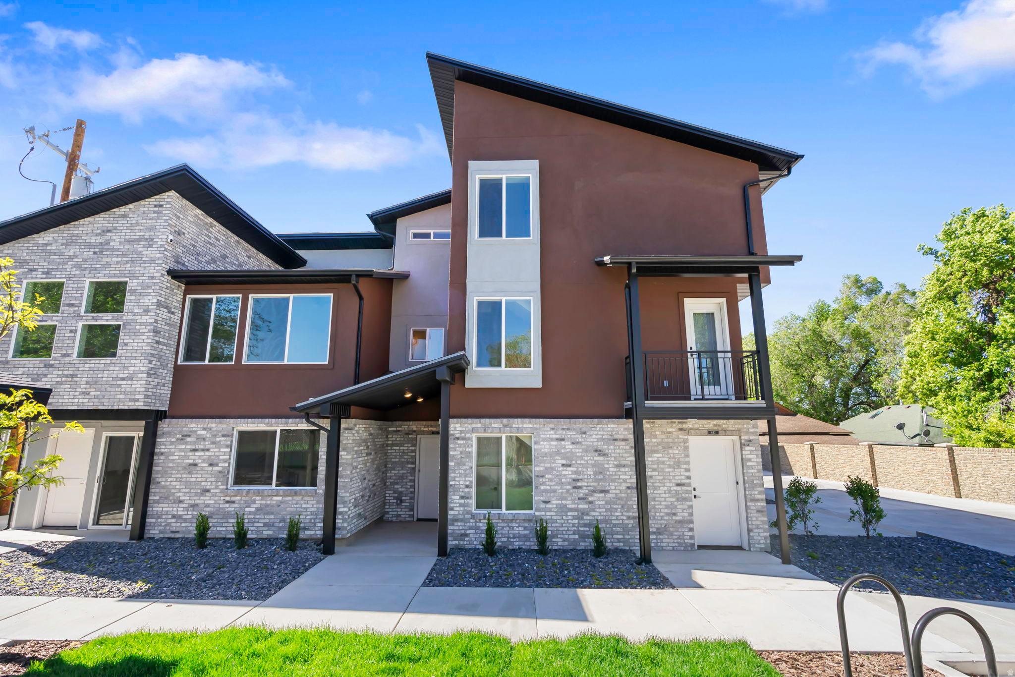 Tucked just off the street, Sycamore Townhomes offer a rare combination of peace, natural light, and a functional layout. This brand-new 2-bedroom home is designed for everyday living. The main floor features an open and airy layout. Upstairs, both bedrooms and the laundry are conveniently located together, making daily routines simple and efficient. Washer and dryer are included, adding immediate value and ease on move-in day. Natural light fills the home, highlighting clean finishes and durable laminate flooring throughout. This home includes a 2-car garage that is wired for an EV Charger and is positioned in a quieter setting away from main road traffic. Residents can also enjoy a shared grassy picnic area, perfect for relaxing or gathering. Conveniently located near the high school, restaurants, a grocery store, and a gas station, these townhomes offer both comfort and accessibility in one well-designed package. There are 7 townhomes available with 2 or 3 bedrooms. Contact Kim for more info.