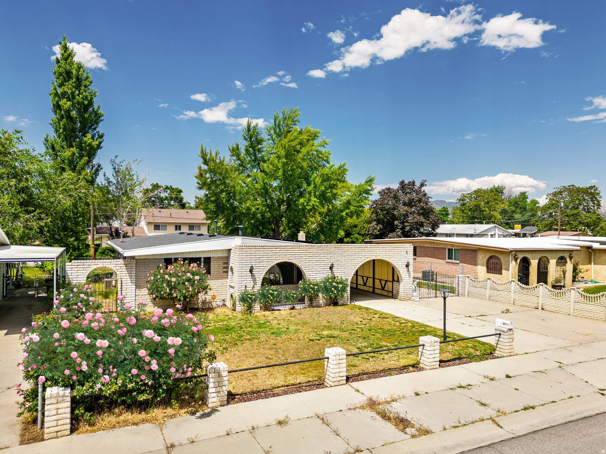 A one-of-a-kind Mediterranean Renaissance ranch-style property is now available to purchase. Come experience this architecturally distinctive single-level living home and take in the gorgeous roses throughout, the fifth-of-an-acre yard, and the romantic masonry archways that are the envy of many. Note the iron gate and courtyard-inspired entry, lantern-style exterior lights, expansive driveway with space for an RV, hand-painted hardwood floors, chalk walls, and old-world details that give this home its unmistakable identity. At the heart of the backyard is a Ginkgo Biloba tree, often called a "living fossil" because its lineage dates back nearly 300 million years. The outdoor space offers a workshop, shed, covered patio, garden space, and room for a trampoline, playground, and more. Best of all, this listing features a brand-new roof and an incredible solar panel system designed to cover almost all of your electricity expenses. This house is a quick stroll to In-N-Out Burger, Costco, Valley Fair Mall, The Westerner, Cracker Barrel, Chik-fil-A, Decker Lake Park and much more. Schedule a showing today and imagine yourself enjoying timeless charm and modern efficiency in a special property close to your favorite entertainment, shopping, and dining destinations. A preferred lender incentive with Temara Stanley at City Creek Mortgage is available, please inquire for details.