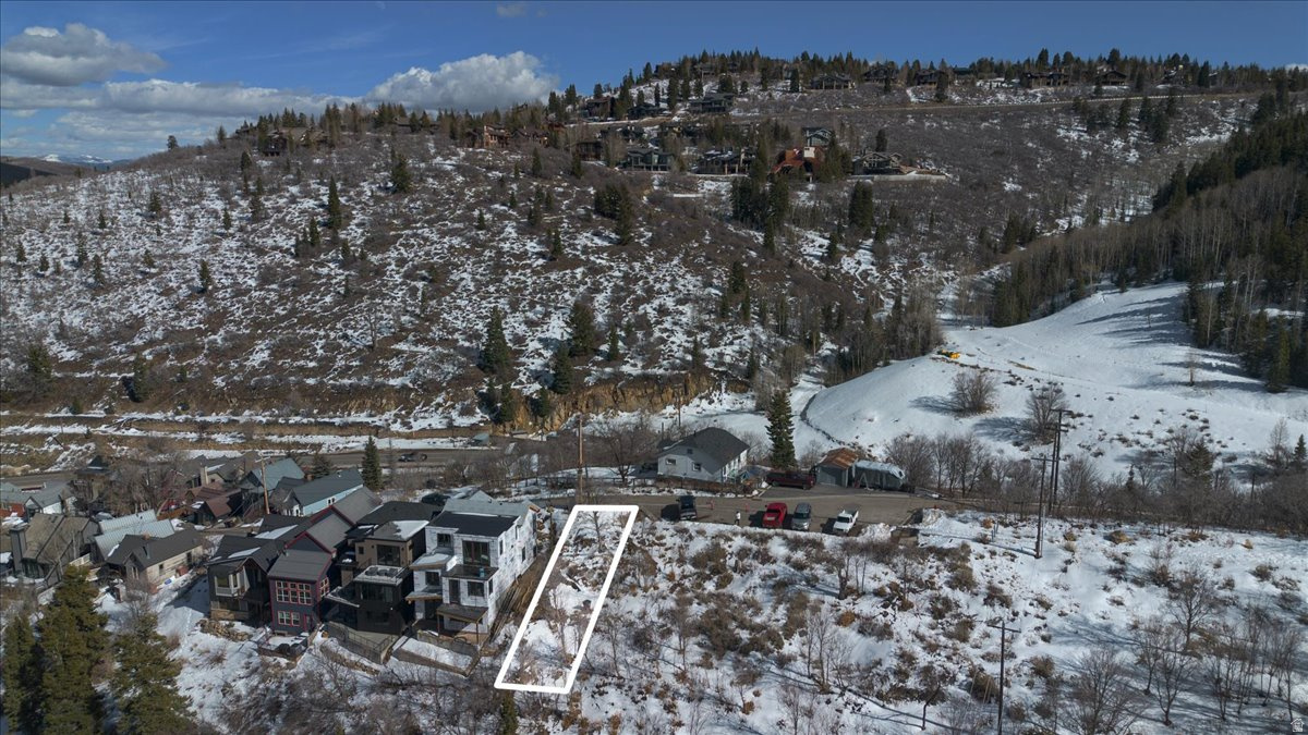 Perched in one of Old Town Park City's most coveted locations, this exceptional homesite offers the rare combination of proximity and privacy--a quick walk from Main Street, yet peacefully removed from the crowds. Take in sweeping ski-run views of Deer Valley and Park City Mountain, creating the perfect backdrop for your custom mountain retreat. Bordering City-owned recreational land, the setting feels open, protected, and serene. Step outside your future home and access the Daly Overlook Trail, seamlessly connecting you to Park City's most popular hiking and mountain biking trails. Whether you're heading out for a morning ride, an aprs-ski stroll, or an evening on Main Street, everything is within easy reach. This is a truly rare Old Town opportunity--panoramic views, trail adjacency, and a private, elevated feel in one of Park City's most iconic neighborhoods. Build your ski home where lifestyle, location, and legacy intersect. Buyer to verify all to their satisfaction