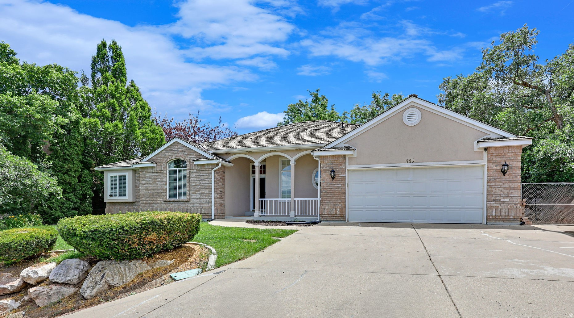Spacious, elevated rambler offering beautiful sunset views, exceptional privacy, and over 3,600 square feet of living space with no HOA! Designed for comfortable living, the home features a large open kitchen, charming butler's kitchen/prep area, and a see-through gas fireplace connecting the kitchen and family room. Step outside to a private backyard retreat with a redwood deck, hot tub, fire pit, and mature trees creating a peaceful setting. The main level offers convenient single-level living with laundry room, generous bedrooms, and a primary suite with dual sinks, garden tub, and separate shower. The basement provides a large theater, game room, or flex space, plus two additional bedrooms, a den/craft room, cold storage, and a roughed-in bathroom. A heated driveway and turnaround space provide year-round convenience. The home also features a distinctive cedar shake roof, adding character, natural insulation, and timeless curb appeal. Conveniently located only minutes from WSU, major hospitals, shopping, dining, and HAFB. Priced significantly below recent comparable sales and offering exceptional value for the size, location, and features. Home warranty included.
