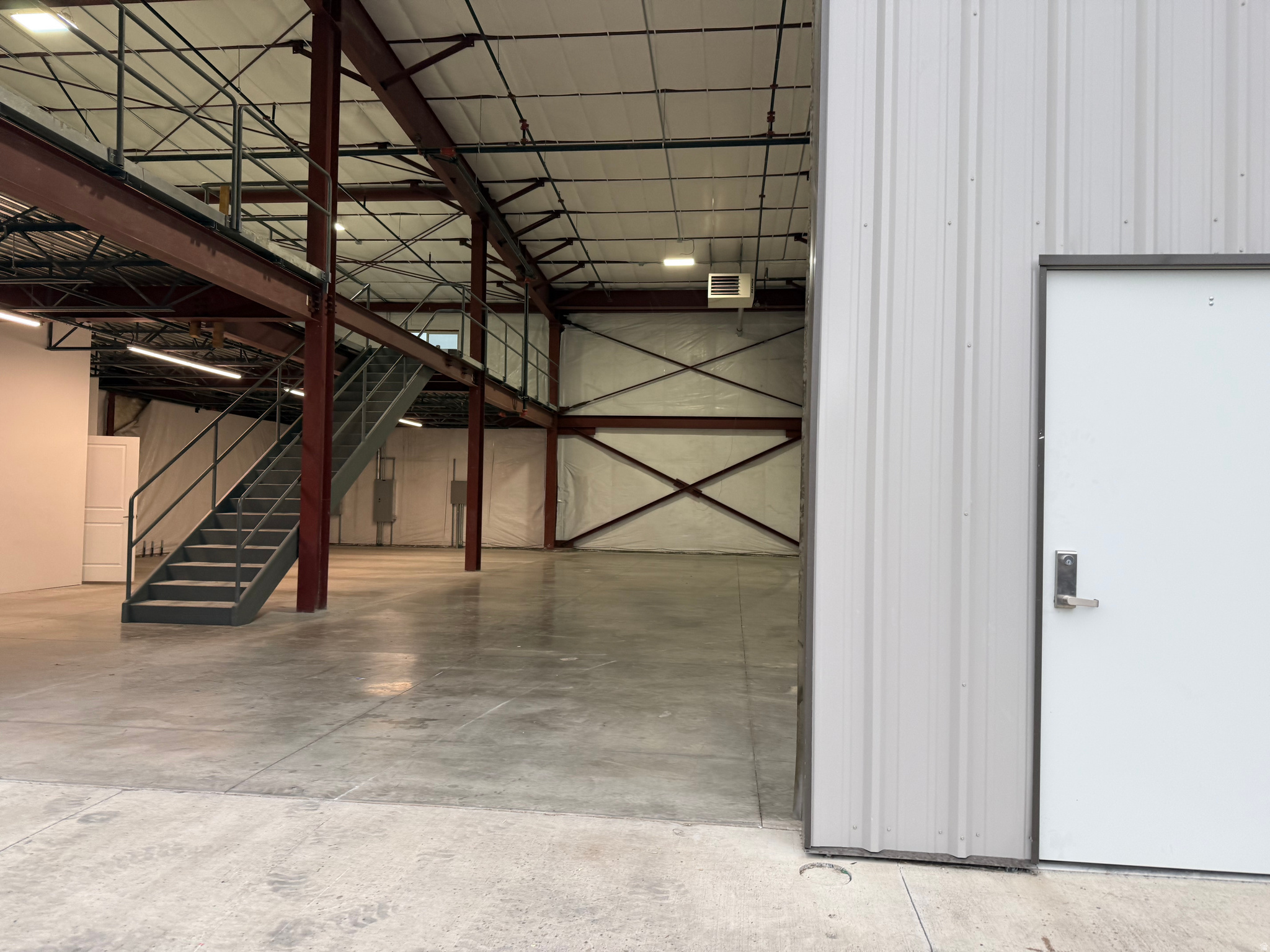 Selling current lease. Almost a year left on the lease. You would need to sign a new lease with the landlord. The current lease expires on 2/28/2027. 4500 sq. ft. $4,153.50 per month. 3 phase, 400 amp power. Lessee responsible for Electricity and Gas only. Large main floor space with mezzanine space. Bath room and drinking fountain. Large 14x14 garage door with 2 other entrances. 4 parking spaces for this unit. Has sprinklers for fire suppression. Call to schedule a showing.  Square footage figures are provided as a courtesy estimate only and were obtained from County Records .  Buyer is advised to obtain an independent measurement.