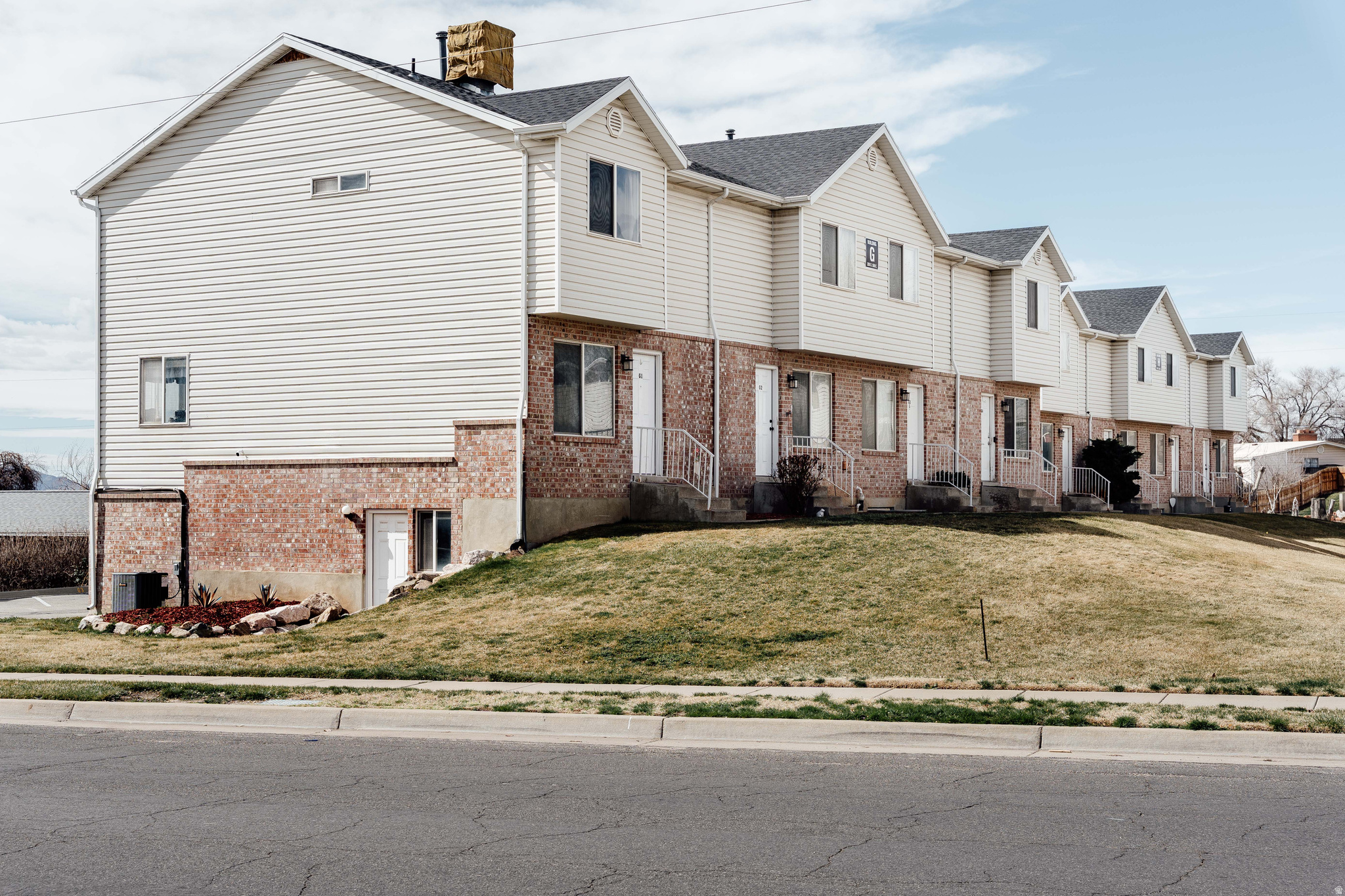 MOTIVATED SELLER! $5,000 closing cost credit available with a full-price offer. Don't miss this opportunity! Tucked into a convenient corner of Clearfield, this end-unit townhome offers a little more breathing room, a little more light, and a layout that simply makes sense.  Inside, the main living space features a kitchen with a workspace island, a dedicated dining area, and an open living room that creates an easy, connected flow for everyday living. A convenient half bath on this level adds practicality for guests and day-to-day routines.  Upstairs, you'll find all three bedrooms, a full bath, and convenient same-floor laundry, offering a comfortable separation between living and sleeping spaces while keeping daily tasks close at hand.  One of the more compelling features here is the bonus basement space with its own side entrance-a flexible area ideal for storage, a workshop, home gym, hobby room, or future finishing potential depending on your needs.  A single-car garage adds practicality, while the location offers quick access to nearby shopping, dining, commuter routes, and Hill Air Force Base.  All told, this home offers a thoughtful balance of function, flexibility, and location-with just enough room to make it entirely your own. Information is deemed reliable but not guaranteed. Buyers and agents should verify all details.