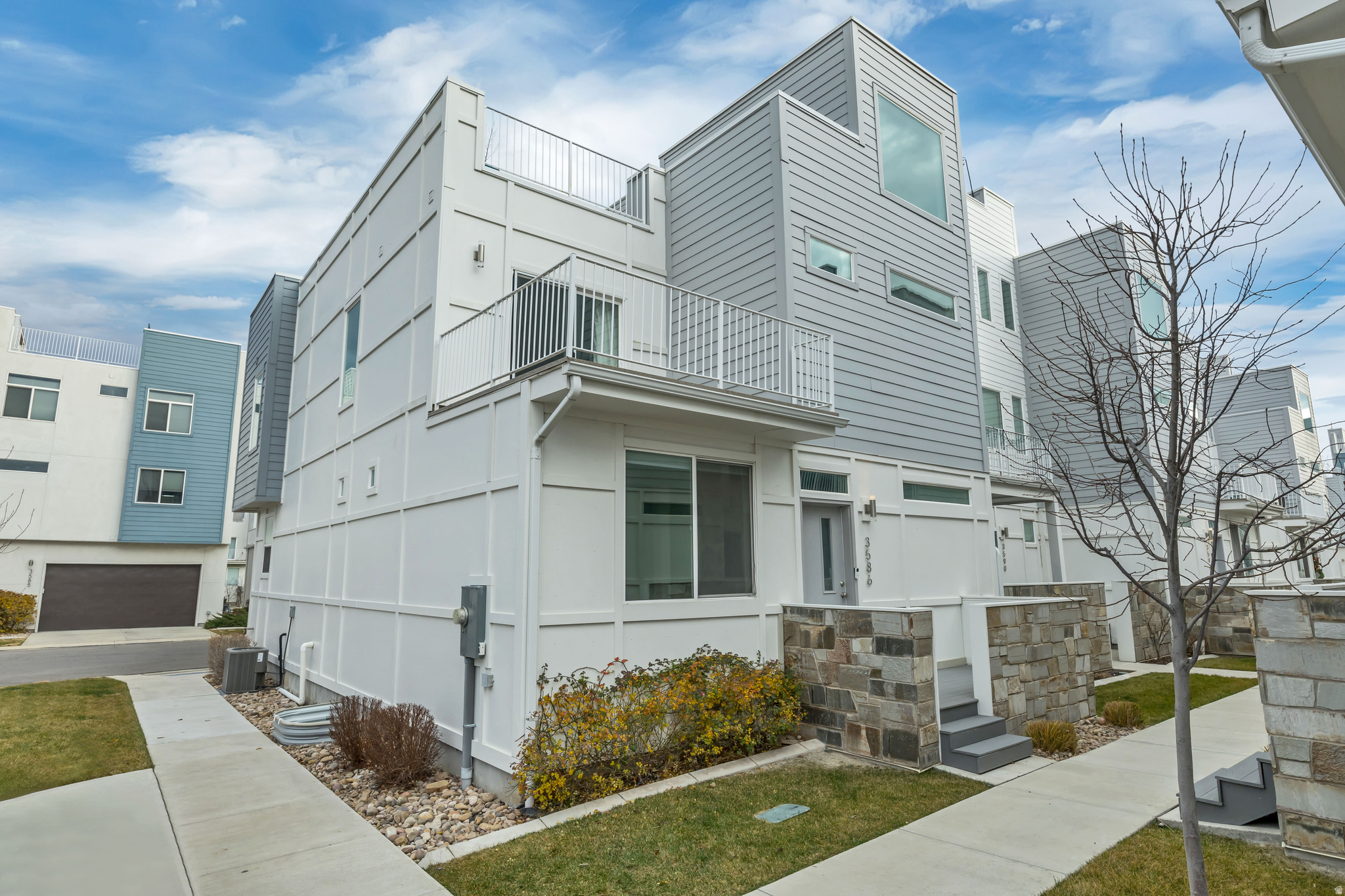 **Back on market through no fault of the property! Ready for a new owner.**  **Seller will contribute $5,000 towards Closing Costs!** This modern END-UNIT townhome is a turnkey gem in a private gated community, offering rare flexibility with BOTH SHORT-TERM and LONG-TERM RENTALS allowed. The open main floor features premium upgrades, leading to a master suite with dual showerheads and a private balcony. Enjoy a fully finished basement bonus room and a massive northeast-facing rooftop deck with gas, power, and stunning views. Perfectly located in central Salt Lake County with quick access to the airport, downtown, and shopping. With the washer, dryer, and fridge included, this home is completely move-in ready and waiting for its next owner to start enjoying those incredible views.