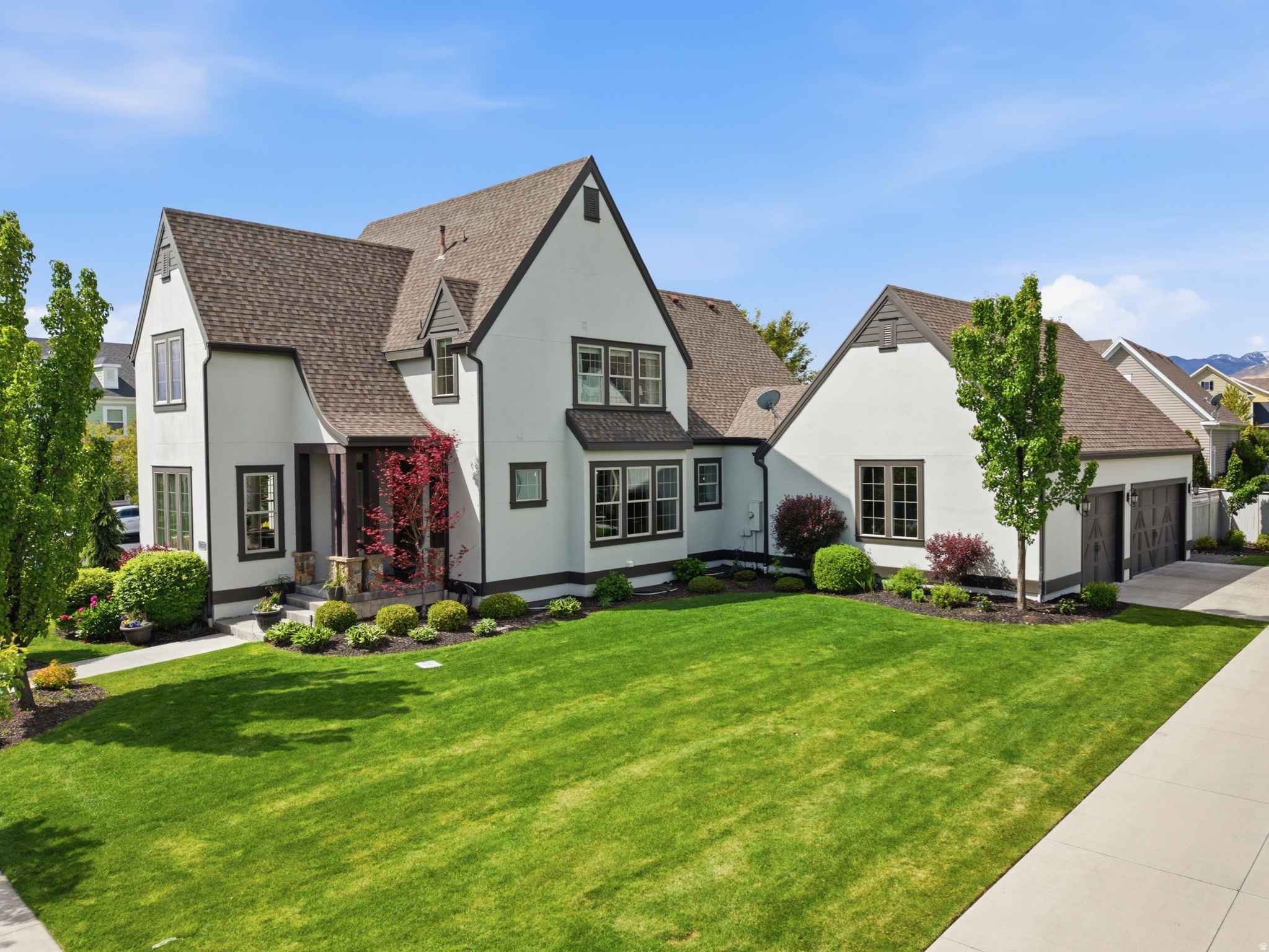 OPEN HOUSE: Saturday, 11am-3pm Situated in Daybreak's sought-after Creekside Village near Oquirrh Lake, this exceptional Rainey-built home offers a rare opportunity to own a spacious, multi-generational residence on a flat, fully usable 0.29-acre corner lot. Spanning over 5,400 square feet, this 8-bedroom, 6-bathroom home is thoughtfully designed for flexibility, comfort, and elevated everyday living.  The main level features an expansive open-concept layout with vaulted ceilings, abundant natural light, and bamboo flooring throughout. A chef's kitchen anchors the space, complete with a gas range, double ovens, two refrigerators, two dishwashers, dual sinks, granite countertops, and a generous walk-in pantry-creating an ideal setting for both refined entertaining and everyday living.  The fully finished walkout basement functions as a true accessory dwelling unit, offering a private walkout entrance, a full second kitchen, additional bedrooms, and a second primary suite. With three washer and dryer hookups throughout the home, the layout provides exceptional flexibility for extended family, long-term guests, or multi-generational living.  Originally built with thoughtful upgrades including extra-height and extra-width garage space, a spacious mudroom, and flexible living areas, this home stands out for both scale and functionality. Additional system upgrades include dual HVAC systems with zoned control, a whole-home humidifier, a tankless on-demand water heater, a water softener, and fiber internet connectivity.  Outdoor features include a fully fenced and private backyard, mature landscaping, outdoor lighting, a custom pergola, and a fully usable yard-an uncommon combination in Daybreak.  Located just steps from Brookside Pool, parks, trails, and Oquirrh Lake access, and within close proximity to Daybreak's premier amenities-including community pools, fitness center, sports courts, and year-round events-this home offers a level of space, flexibility, and lifestyle that is rarely available in the community.