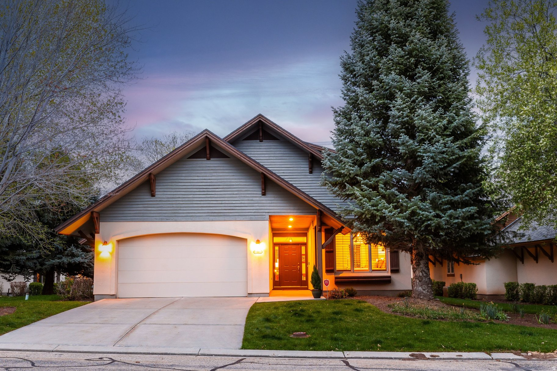 Tucked away in the desirable Valais community in Midway, Utah, 1164 N Village Circle is a mountain retreat for sale near Park City, defined by privacy, location, and timeless alpine beauty. Ideally framed by HOA open space on two sides, this 4-bedroom, 3-bathroom single-family home offers a sense of seclusion. This residence features mountain views and a tranquil natural setting, where the gentle sound of the adjacent stream creates a calming backdrop throughout the day and night. Surrounded by mature trees and lush landscaping, this home feels private, peaceful, and immersed in nature. The Valais community is known for its picturesque design, with charming streams, waterfalls, and ponds woven throughout, creating a uniquely serene and walkable environment. Inside, solid wood finishes highlight a level of craftsmanship that is increasingly hard to find in newer construction at this price point. This property reflects a classic mountain contemporary style with a functional, inviting layout that provides flexibility for future personalization, all within an irreplaceable location. Offered for sale by its original owner and used only occasionally. Just 15 minutes from Deer Valley Ski Resort, soon to be the largest in the United States, and 25 minutes from Historic Park City's Main Street, the home offers effortless access to world-class skiing and year-round recreation, along with dining, shopping, and entertainment. The HOA enhances the lifestyle with multiple clubhouses, pools, and community amenities, along with maintenance-free living that includes yard care and landscaping, making this Midway, Utah property ideal as a primary or secondary residence, or investment property. This is an exceptional opportunity to own a Utah mountain retreat in Valais, one of the most idyllic communities near Park City, combining natural beauty, convenience, and long-term value.