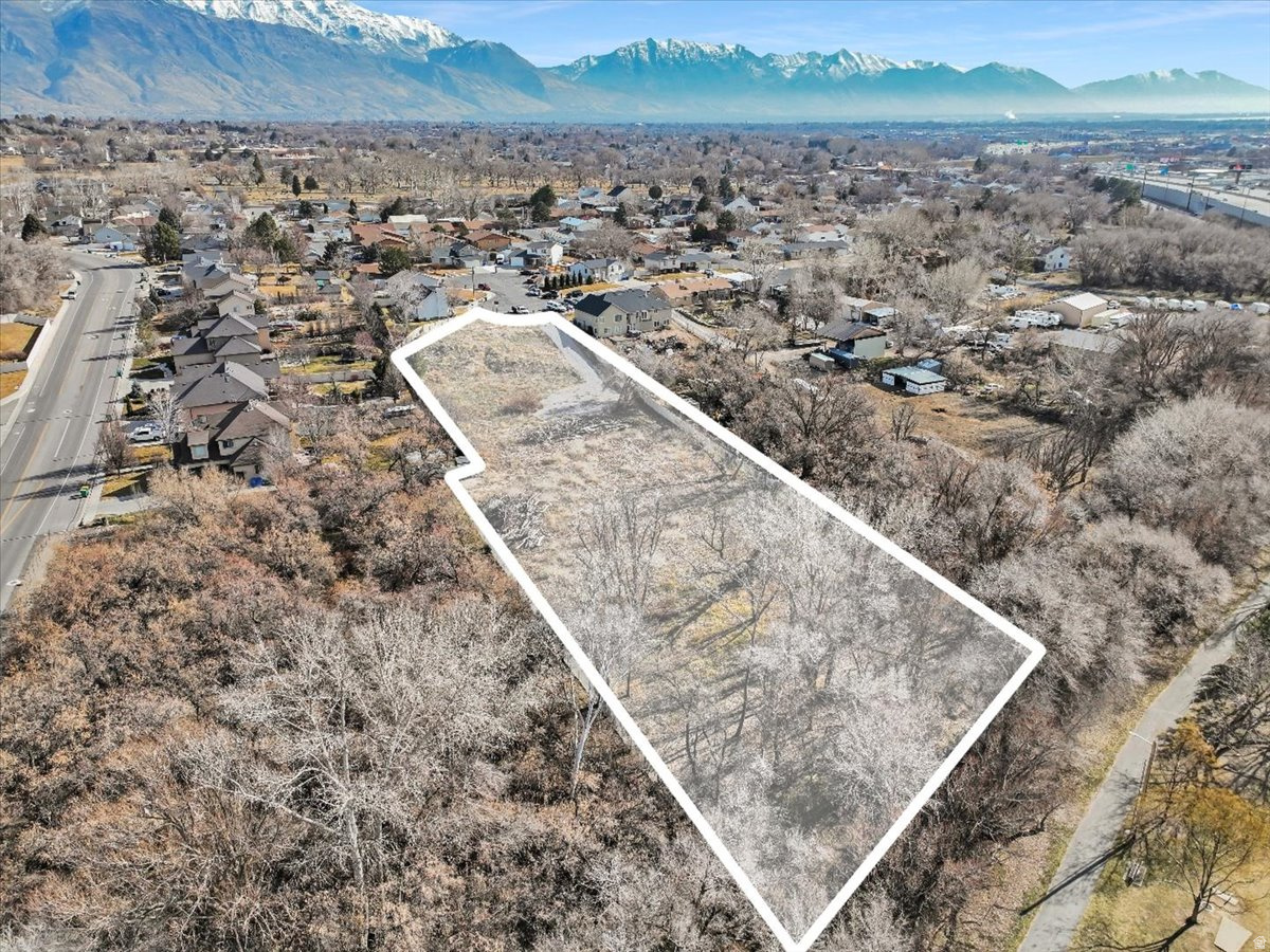 A Once-in-a-Lifetime Lot in the Heart of Utah County. Opportunities like this simply don't come around anymore. This is one of the rare properties that gives you space, privacy, and freedom, without sacrificing convenience. Tucked away on an oversized, residential-agricultural lot, this property delivers the lifestyle most buyers dream about but almost never find. You especially can't find a lot like this that doesn't require you to drive 30 minutes outside of the city to find it! Located just minutes from Thanksgiving Point, Silicon Slopes, and Traverse Mountain Outlets, you're perfectly positioned near Utah County's major employers, dining, shopping, and entertainment. With easy access from the east side of I-15, you can skip the traffic headaches and get where you're going with ease. What truly sets this property apart is the size. With generous acreage and RA zoning, you have the freedom to bring your vision to life; horses, chickens, gardens, barns, ADUs, workshops, or even a small homestead. Whether you're dreaming of self-sustained living, multi-generational housing, or simply room to breathe, this lot gives you options that are nearly impossible to find this close to everything. Mature trees provide natural privacy, while the property backs up to Dry Creek Park and an established trail system, creating a peaceful, scenic backdrop and direct access to outdoor recreation.This is the true definition of "the best of both worlds." If you've been waiting for the perfect blend of land, lifestyle, and location, this is it. Lots like this do not exist anymore! Don't miss your chance to secure this dreamscape before it's gone!