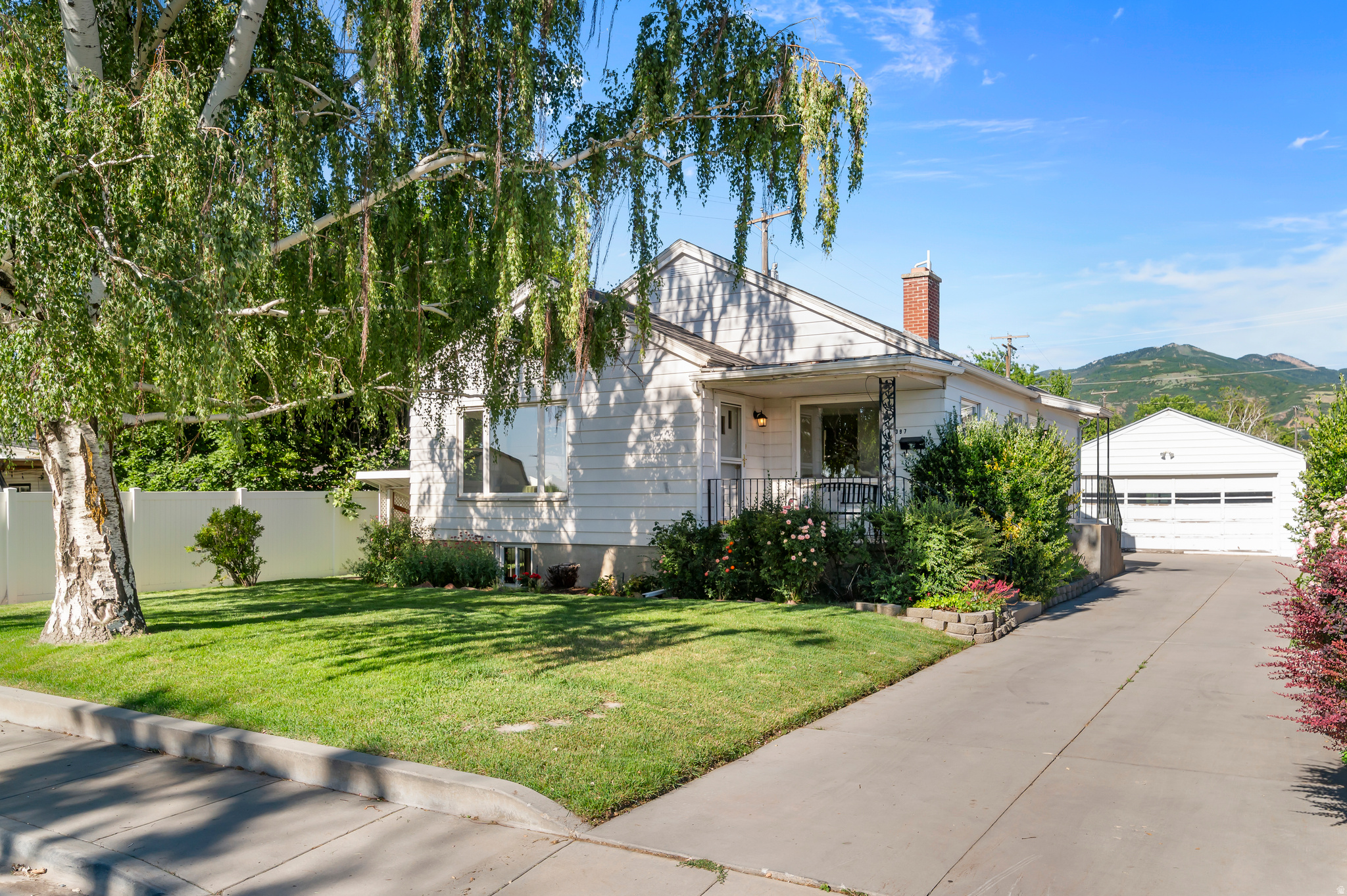 Rare mixed-use opportunity in the heart of Bountiful! This charming 1950 home is zoned as C-G (Commercial General) but can also be used as a residence, creating endless possibilities for homeowners, investors, or small business owners. Situated on a flat .30-acre lot, the property features 2 bedrooms and one bathroom on the main level and 2 additional bedrooms and one bathroom in the partially finished basement. Hardwood floors, a large picture window, kitchen pantry, and built-in storage provides vintage charm in this centrally located property. Kitchen refrigerator included along with central air conditioning and newer water heater (2021). The basement includes two separate entrances, a kitchenette, gathering area, and storage making it ideal for multi-generational living, guest quarters, rental income as a potential ADU, or home-based business use. Original character blends with practical functionality throughout the home. Outside, you'll find a detached 2 car garage with shed, extended driveway, a beautiful variety of rose bushes and a large garden area at the rear of the property with plenty of room for gardening, recreation, or additional outdoor amenities. Only 5 minutes to I-15, the generous property provides privacy and flexibility while maintaining convenient access to shopping, dining, schools, and commuter routes. Whether you're seeking a unique live/work property, investment opportunity, or a home with room to grow, this versatile Bountiful property is full of potential. Don't miss the 3D virtual tour and schedule a showing today!
