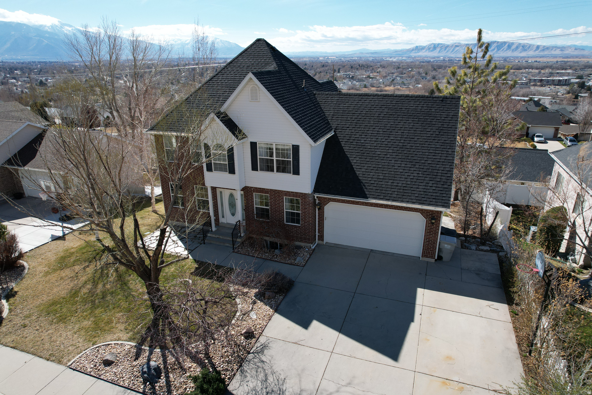 OPEN HOUSE SATURDAY JUNE 13TH 11 AM TO 1 PM!**Reduced price! Rare opportunity to enjoy beautiful valley views from every level of your home! Inside the home or out in the yard the setting is truly amazing! Great East Bench Springville location.  Flat driveway with basketball standard is ideal for summer and winter!  Extra parking off and on street. Beautifully updated home with basement accessory apartment you can rent for approx. $1,500 per month or is great for mother in law or any family/friend that would benefit from their own space.  New kitchen in 2021 on main floor with quartz countertops, backsplash, copper farm sink, and gas range! LVP flooring on main floor and basement in 2021.  Gas Fireplace.  New roof shingles in 2023.  Insulated garage with new garage door and opener in 2022.  Humidifier and water softener.  On demand water heater. Radon system in 2023.   Whole house fan cools the house down quickly during summer nights.  New Heating and Air equipment in 2024 with 3 zones so you are more comfortable and efficient on each level! Smart Thermostat, smart door bell, smart buyer... You will love the deck, patio space and the yard.  This home is a must see, come quickly or you will miss this one!