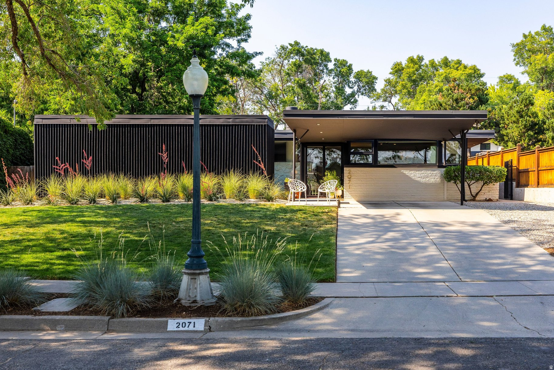 This mid-century modern home presents a rare opportunity to own something truly distinctive. Properties with this level of architectural character, clean design, and untapped potential are increasingly difficult to find-offering the ideal canvas for a sophisticated buyer with an appreciation for timeless style. Situated on a quiet, flat, tree-lined street, the home features a desirable main-level primary suite, expansive windows that flood the interiors with natural light, and a spacious kitchen footprint with exceptional potential for gathering and entertaining. Outside, the flat backyard creates a private retreat complete with mature trees, a sport court, and patio space designed for both relaxation and recreation. The location is equally compelling, offering quick freeway access and just minutes from the University of Utah, downtown Salt Lake City, Emigration Canyon, Big and Little Cottonwood Canyons, and Parley's Canyon-providing an easy escape to Park City and the mountains beyond.