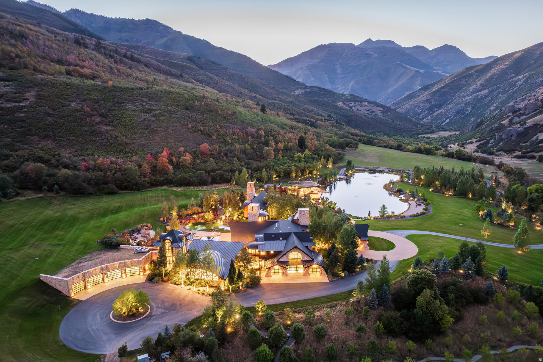 Inspired by the Lord of the Rings, designed by Michael Upwall and built by Magleby Construction, this estate is among the most remarkable in Utah. Nestled on 30 acres in the secluded South Fork of Provo Canyon, it is a property defined by privacy, scale, and artistry. The 23,000 sf main residence and the 6,200 sf guest house are thoughtfully positioned along a private pond accentuated by waterfalls and streams, creating a setting both serene and dramatic. The architecture blends stones quarried in Utah with reclaimed barn wood and massive timbers, giving the home a timeless mountain presence. Inside, the design is refined and modern with light walls, clean lines, and rich dark accents balanced by natural textures. Wall of glass open to sweeping views in every direction. Amenities elevate the estate to the level of a private retreat: indoor basketball and racquetball courts, a 50+-foot climbing wall, golf simulator, theater, game lounge, sauna, hot tub, and an outdoor pool and natural stone diving features into a pond. The large two-bedroom lake house and pond extend the experience with paddleboarding, fishing, rope swings, and evenings on the water. Expansive lawns can host gatherings of every size, while private trails connect directly to public lands. With the Provo River minutes away, Sundance Mountain Resort just 15 minutes from the gate, and Deer Valley's East Village only 45 minutes from the property, the lifestyle here is without equal. Additional information can be provided to qualified buyers.