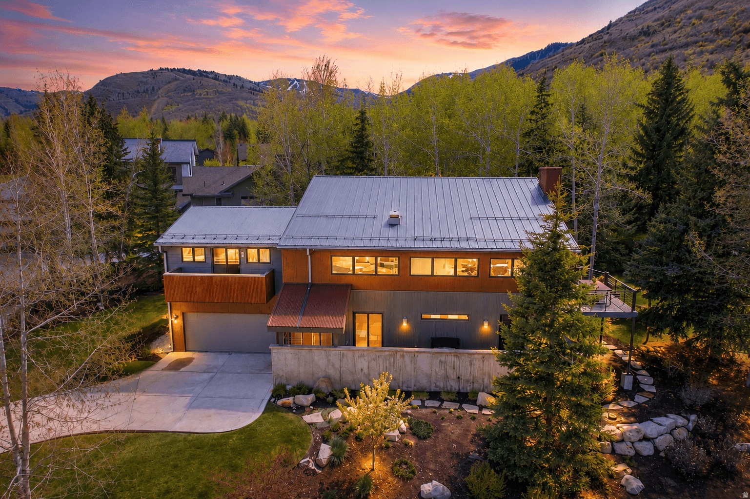 Modern Mountain Treehouse in Coveted Thaynes Canyon  Nestled beside nearly three acres of Rotary Park open space and mature trees, this architecturally striking home offers a rare "treehouse" living experience in the heart of Park City. This home was taken down to the studs and extensively rebuilt in 2011 with new electrical, plumbing, roof, windows, and updated systems throughout, the home blends modern comfort with a warm, artistic design.  Featuring 4 spacious bedrooms, 4 bathrooms, and an expansive family room with custom bunk space that comfortably sleeps nine, the home is designed for both entertaining and everyday living. Vaulted ceilings and walls of windows flood the main living area with natural light and frame serene wooded views from nearly every angle.  The thoughtfully curated chef's kitchen features premium Viking appliances and a coveted La Cornue oven and range, unique artistic interiors create a stylish yet inviting mountain retreat. Multiple outdoor spaces, including two decks and two patios, invite year-round enjoyment of the peaceful setting.  Ideally located just minutes from Park City Mountain Resort, trails, and Main Street dining, this is a truly one-of-a-kind Park City home.