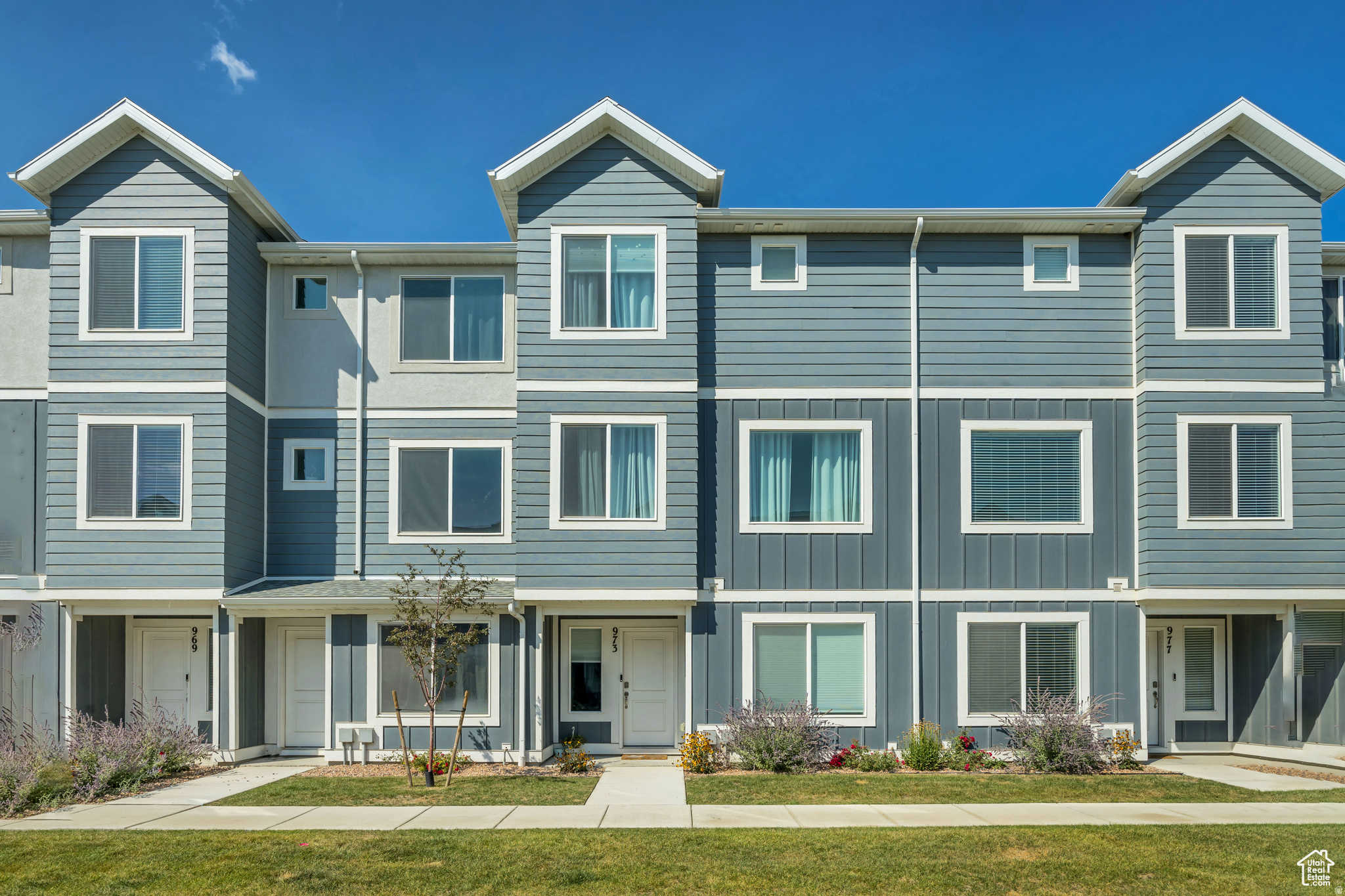 -Modern Living in Saratoga Springs. Step into comfort, convenience, and community with this like new Oliver townhome, built in 2023 by DR Horton. Designed with both style and function in mind, this home offers 2,079 square feet of thoughtfully planned living space across three levels. Inside, you'll find four spacious bedrooms and three full bathrooms, including a luxurious owner's suite on the third floor. The main floor features an additional bedroom and bathroom, providing flexibility for guests, a home office, or multi-generational living. The open-concept kitchen serves as the heart of the home, complete with a massive quartz island, stainless steel appliances, and modern cabinetry-a perfect gathering place for meals, conversations, and entertaining. This home is move-in ready with smart features via a Smart Home package and Active Radon Mitigation System, plus a two-car garage with private driveway for convenience and peace of mind. -A Community Designed for Connection. Living here means more than just owning a home-it's joining a vibrant community. Residents enjoy access to a sparkling pool, multiple neighborhood parks, pickleball courts, and a clubhouse designed for gatherings and celebrations. With HOA-maintained landscaping and exterior care, you can spend more time enjoying the amenities and less time worrying about upkeep. -The Best of Saratoga Springs. Set in one of Utah County's most dynamic cities, this townhome places you at the center of growth, opportunity, and natural beauty. Saratoga Springs offers: Convenient shopping and dining options just minutes away, Top-rated schools within reach, making mornings easy and family life seamless. Scenic walking trails and recreational access to Utah Lake, perfect for evening strolls or weekend adventures. Easy access to I-15 and Silicon Slopes, keeping work commutes and city trips within easy reach. The Lifestyle You've Been Waiting For. This home delivers the ideal balance of modern finishes, resort-style amenities, and an unbeatable location. Whether you're sipping coffee on your private deck, gathering with neighbors at the clubhouse, or exploring the outdoor beauty of Saratoga Springs, you'll find every day enhanced by the lifestyle this community offers.