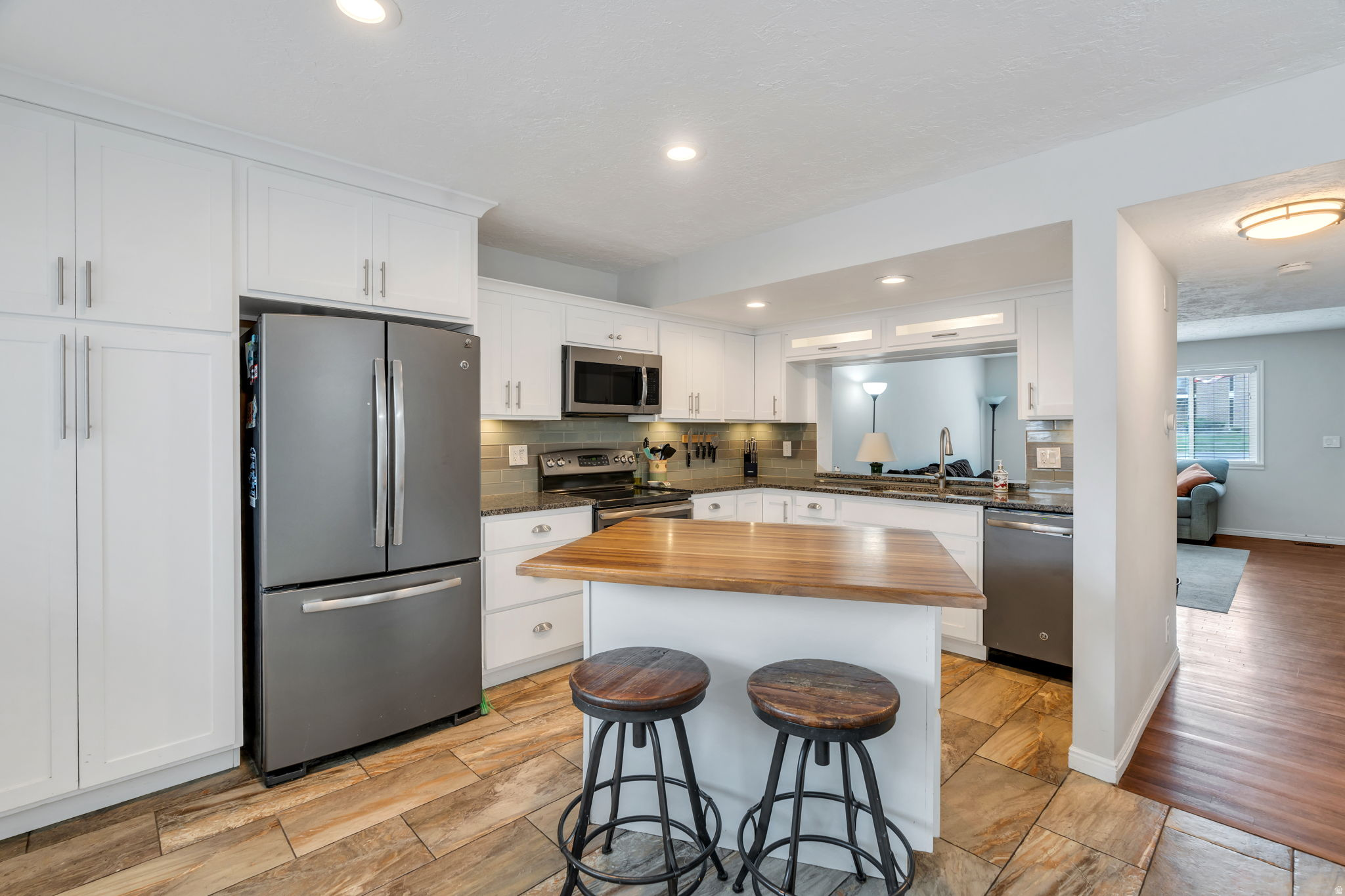 Open House: Saturday - 9:30am - 11am - June 20th. Video walkthrough of home: https://youtu.be/ufCSPVyUKHk   Welcome to this beautifully maintained 4-bedroom, 3-bathroom home located in a highly sought-after community. Residents enjoy access to outstanding amenities, including a swimming pool, fitness center, clubhouse, and playground...perfect for both relaxation and everyday enjoyment. The home is also ideally situated near a local golf course, adding to its overall appeal.  A rare and highly desirable feature of this property is the ample guest parking located directly in front of the home...something not commonly found within the community. This home is on the waitlist within the HOA to be able to be rented it out and used as an investment property - It likely will be possible within the next 12-18 months! Inside, you'll find a bright, open-concept kitchen filled with natural light, creating a warm and inviting atmosphere that's perfect for both daily living and entertaining. The finished basement adds even more versatile space, featuring a fourth bedroom, a dedicated laundry area, and a spacious living room that could easily be transformed into a home theater. It is already wired for surround sound, making it ready for a true entertainment experience. The home also offers generous storage throughout.  Centrally located, this home provides exceptional convenience-whether you're heading up to the mountains for skiing, spending time in Park City, catching a flight at the airport, or simply commuting around town, everything you need is just a short drive away. Buyer to verify all listing and HOA info.  HOA covers some utility costs!...It covers water, sewage, garbage, clubhouse, pool access, maintenance of grass, bushes, HOA also paints the exterior of homes and pack patio every 3 years.